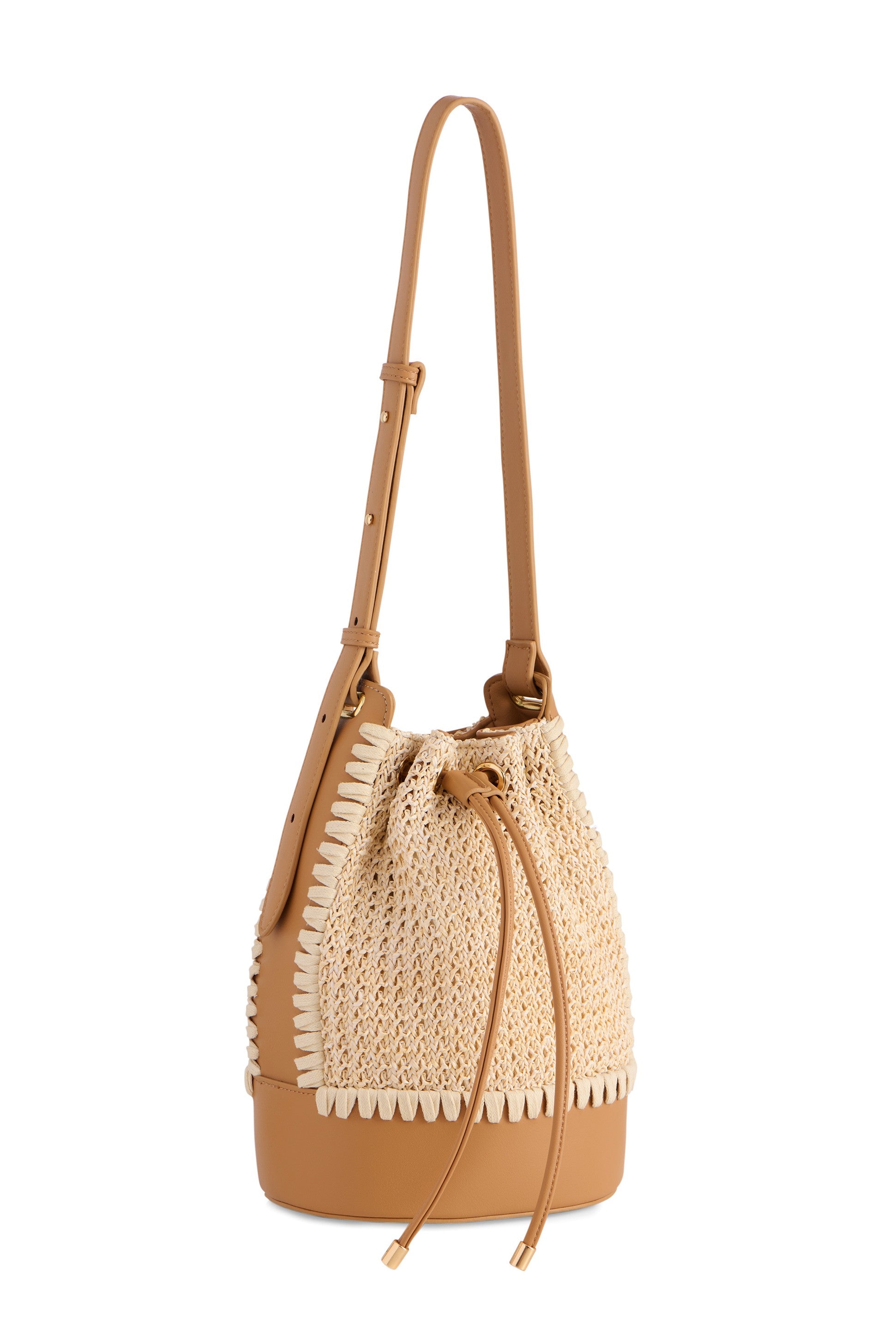 The Mia Bucket Bag by South Moon Under features a tan leather design with a woven straw body, adjustable shoulder strap, and drawstring closure. Decorative stitching along the edges adds chic style—perfect for summer outings.