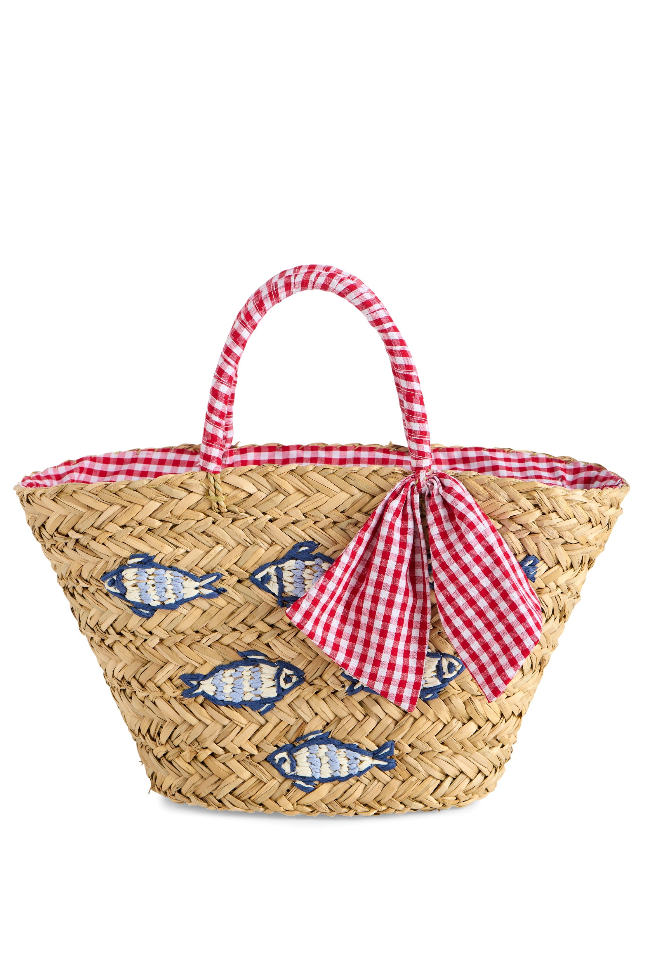 The South Moon Under Marseille Tote is a seagrass purse with blue and red embroidered fish, gingham fabric handles, a matching bow, and gingham lining at the opening—a nautical touch for any look.