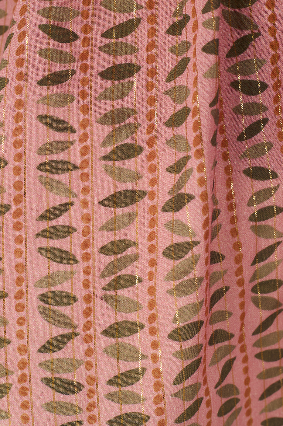 Close-up of the Pink Serenity Lurex Peplum Top by Dress To, showcasing pink fabric with green leaf lines, orange dots, and gold stripes—ideal for a bustier bodice or peplum flare look.