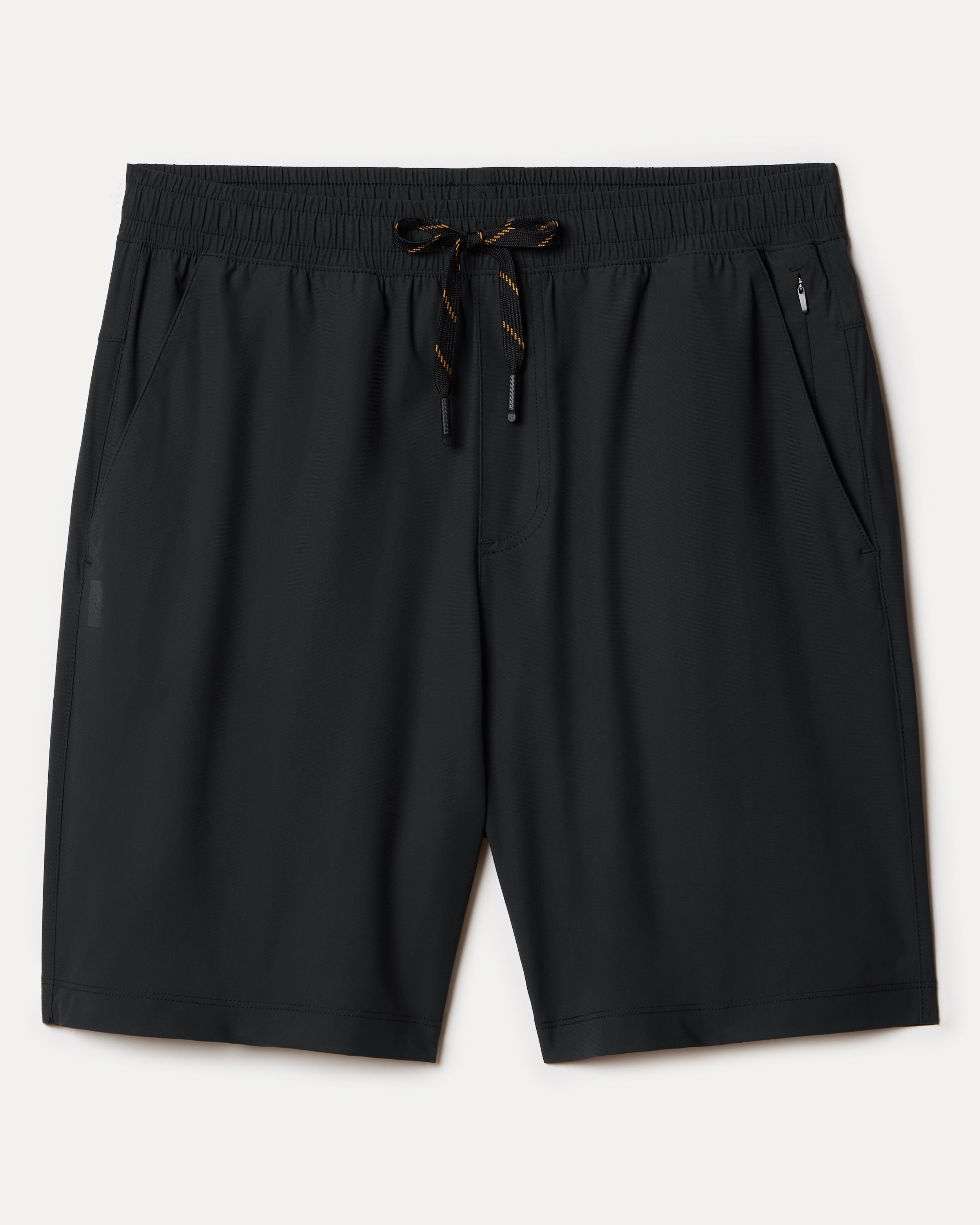 South Moon Under Pursuit Shorts 7 In Unlined in black feature a standard fit, elastic waistband, two side pockets, and a right zipper pocket, shown laid flat on a light background.