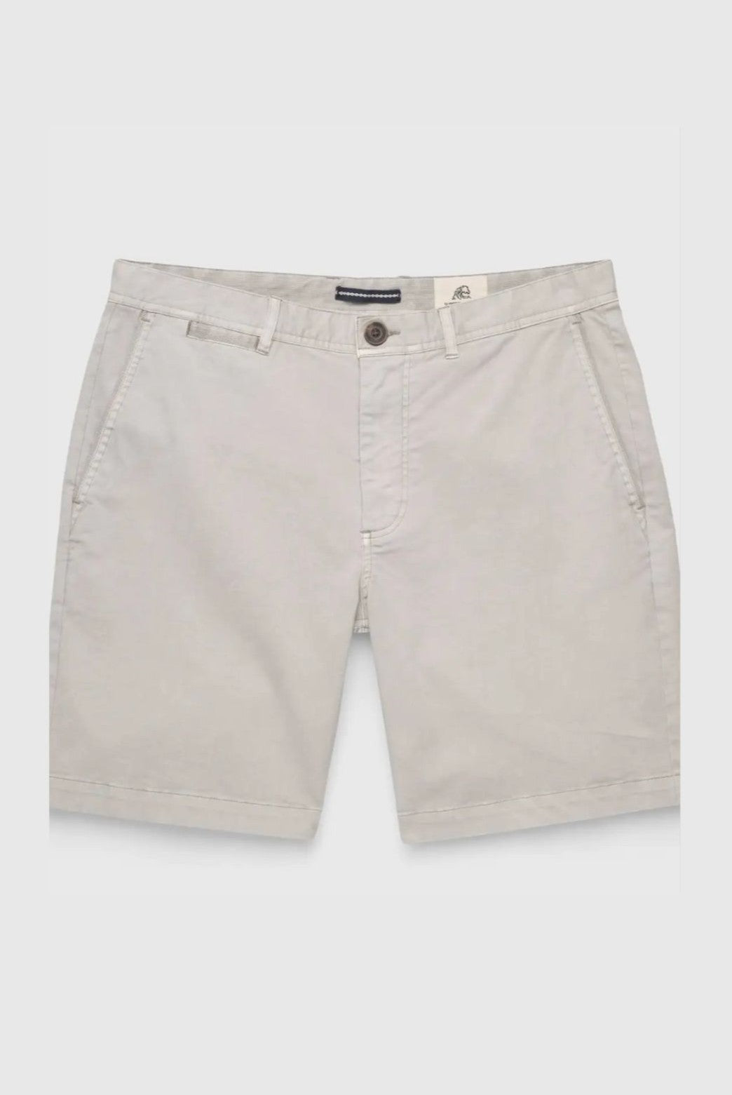 The Andrew Stretch Twill Short by Surfside Supply Co. is a pair of light grey men's chino shorts made from cotton spandex, featuring side pockets, belt loops, and a button closure with zip fly, shown flat on a white background.