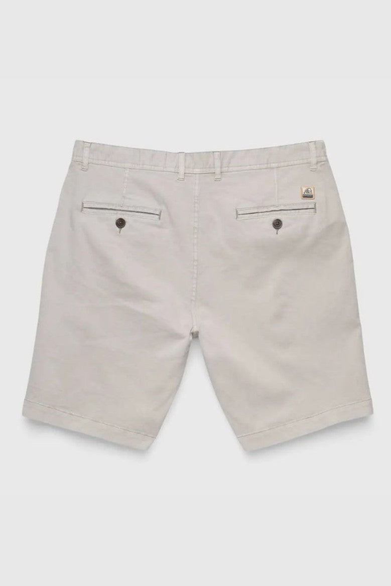 Back view of Surfside Supply Co.'s Andrew Stretch Twill Short in light beige, featuring belt loops, zip fly, two buttoned welt pockets, and a small branded patch above the right pocket.