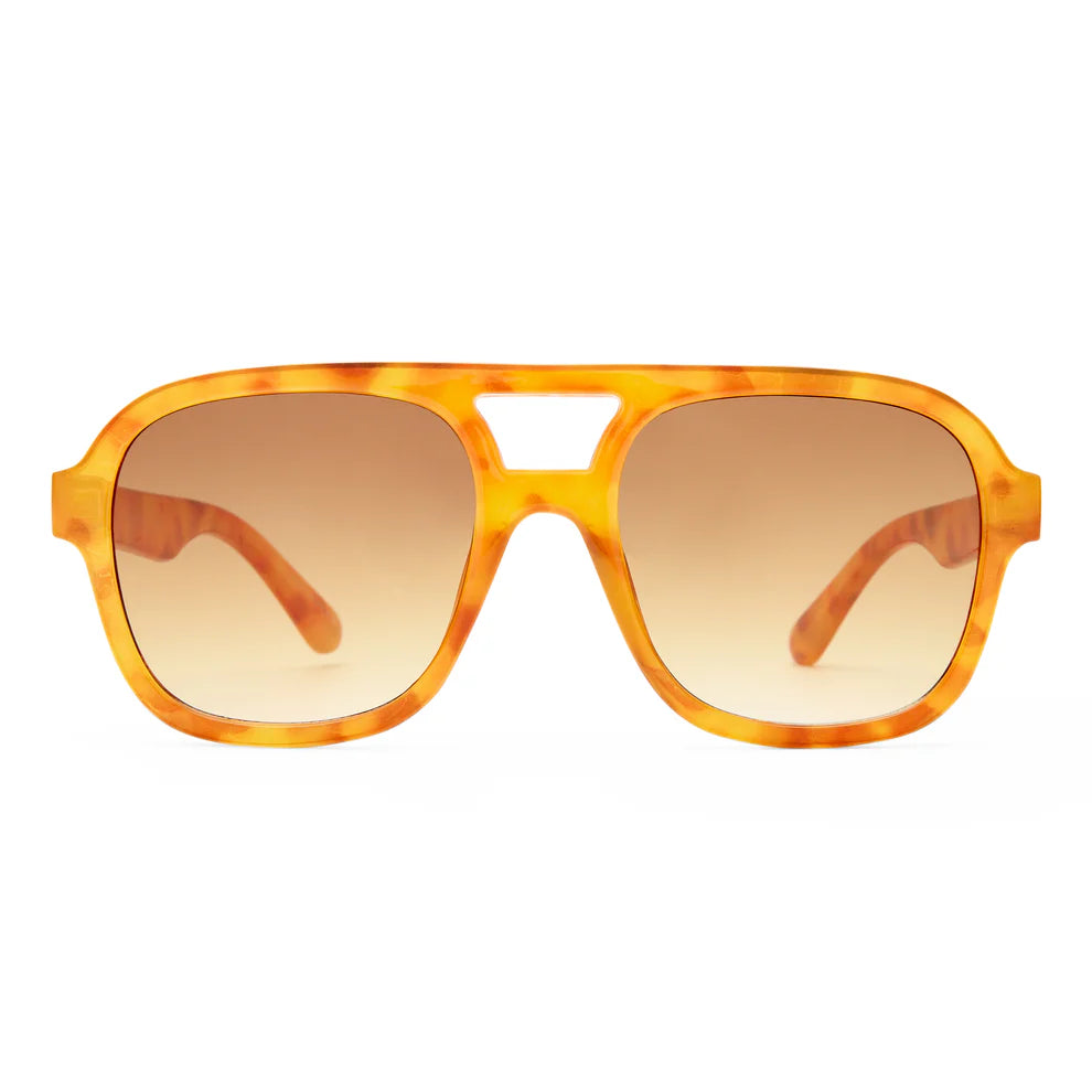 The Aire Whirlpool Sunnies are orange tortoiseshell aviator sunglasses with large brown gradient lenses and a bold vintage frame, displayed on a white background.
