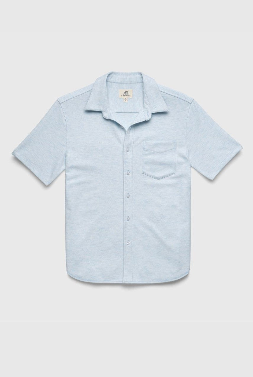 The Surfside Supply Co. Tony Short Sleeve Burnout Knit Shirt in light blue features a regular fit, button front, chest pocket, spread collar, short sleeves, and a slightly curved hem, shown on a plain white background.