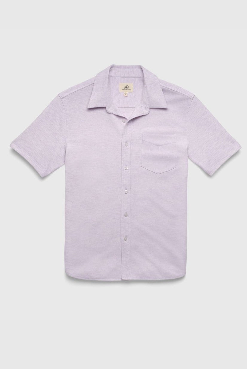 The Tony Short Sleeve Burnout Knit Shirt by Surfside Supply Co. is a light purple, regular-fit shirt with a button front, classic collar, short sleeves, and single chest pocket, shown against a plain white background.