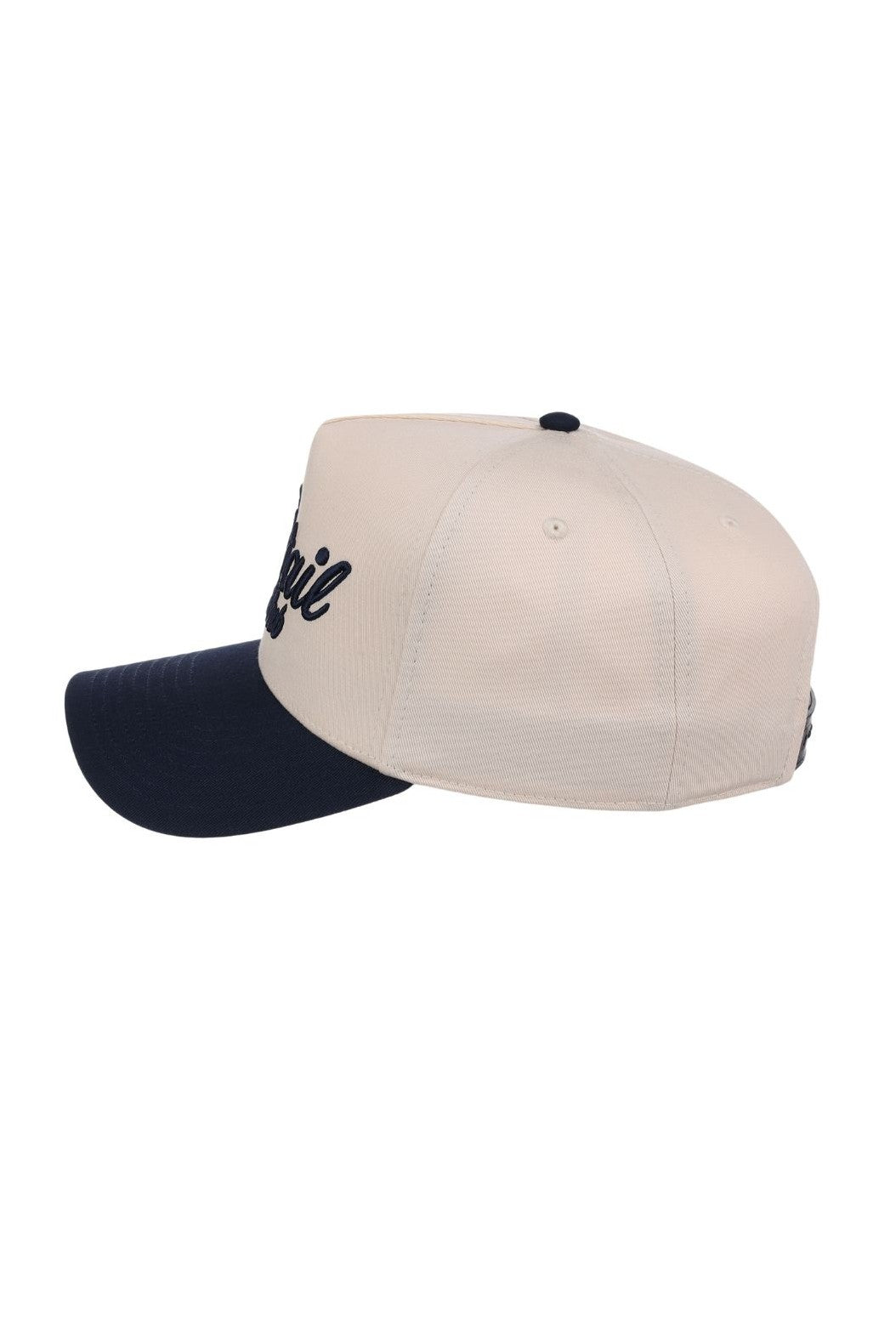 A side view of the South Moon Under Smu Cocktail Club 5-panel Hat, featuring a structured fit in beige and navy with partially visible black embroidered lettering on the front panel.