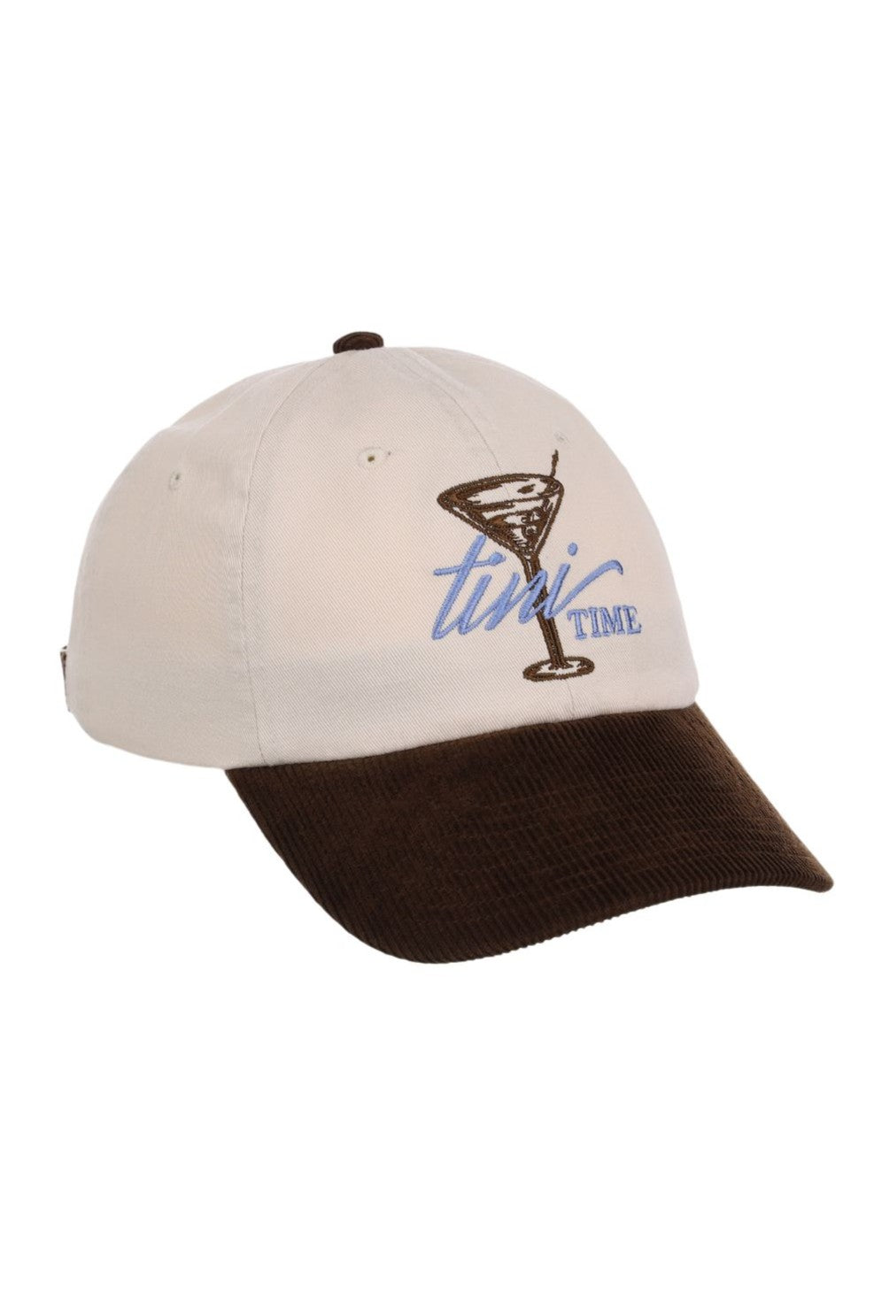 The Smu Tini Time Cap by South Moon Under is a beige baseball cap with a brown corduroy brim and a low crown, featuring an embroidered martini glass and the words "twist TIME" in blue and brown on the front.