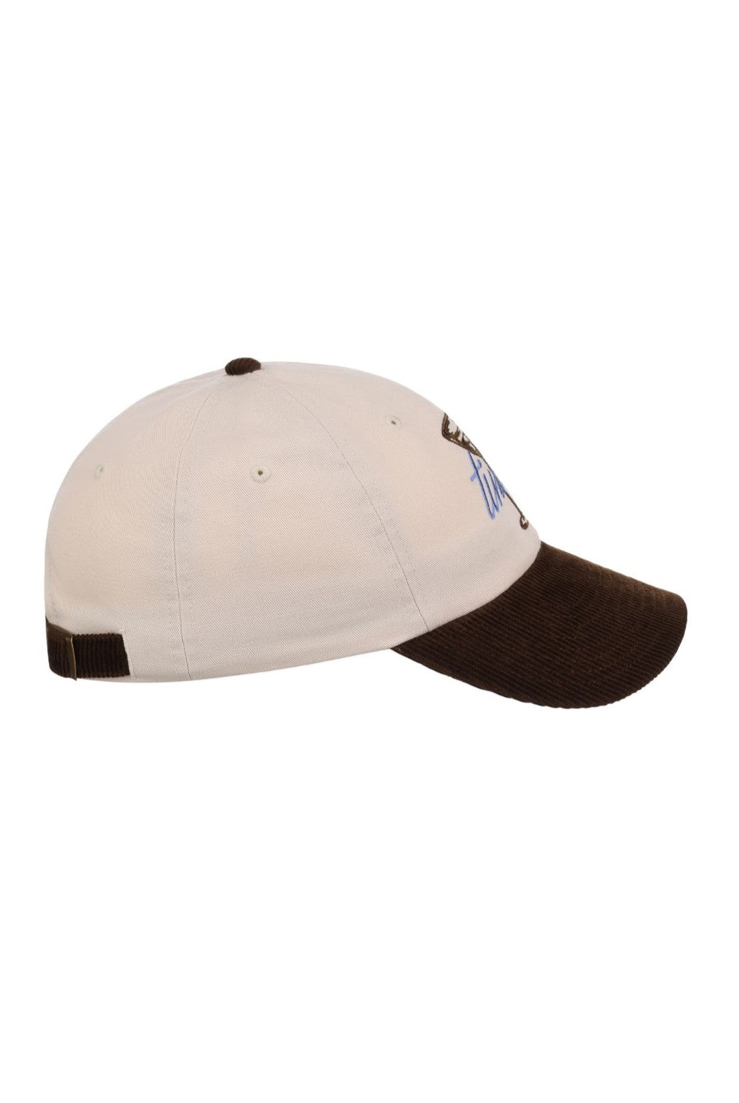 A side view of the South Moon Under Smu Tini Time Cap, featuring a white, low crown, a brown corduroy flat bill, and an adjustable strap at the back. Blue embroidery is partially visible on the front.