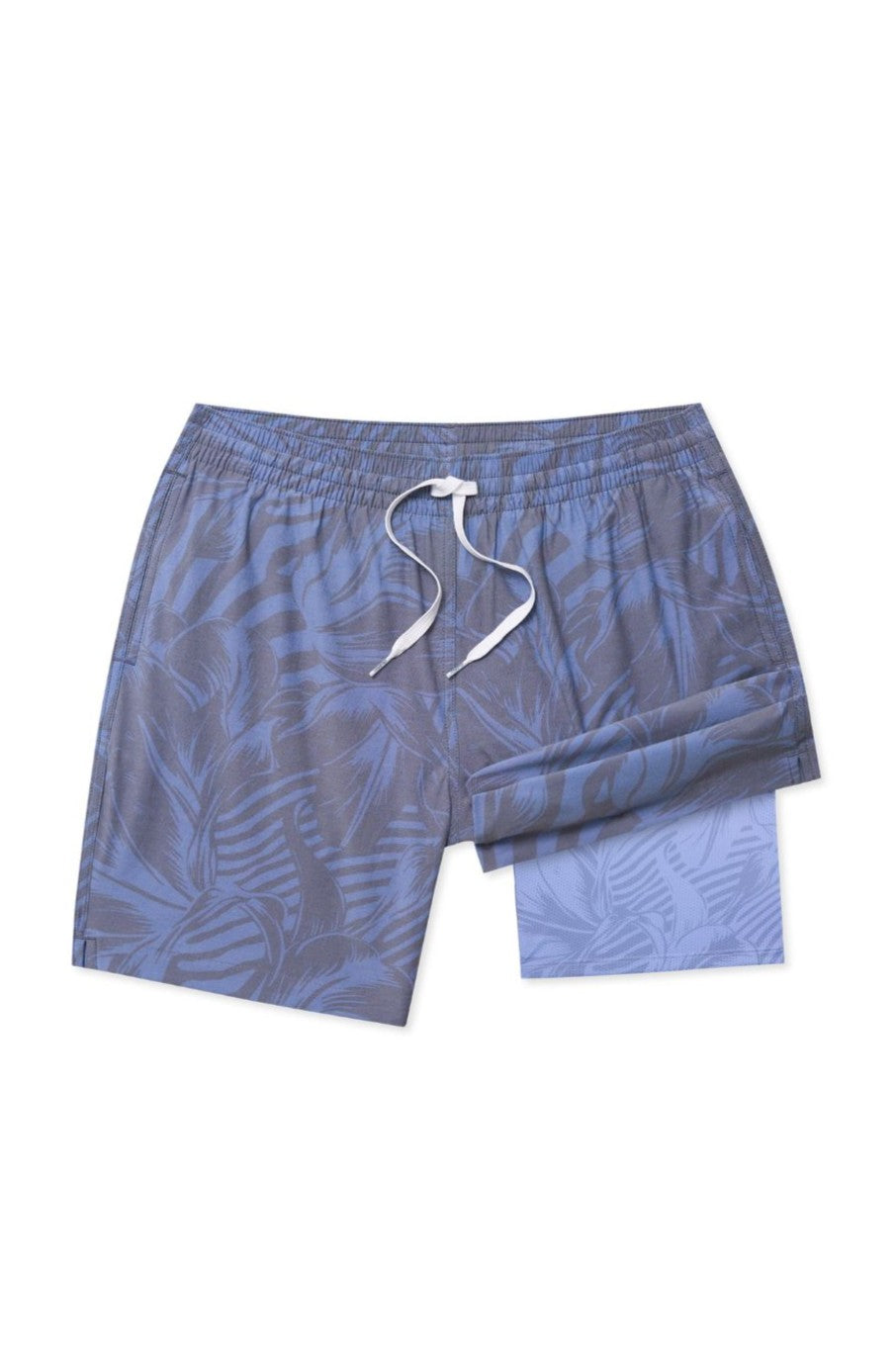 The Indigo Crazies 7 In Lined Swim by Chubbies features blue quick-dry fabric with a subtle palm leaf pattern, a white drawstring, matching inner lining, and a zippered pocket, shown against a white background.