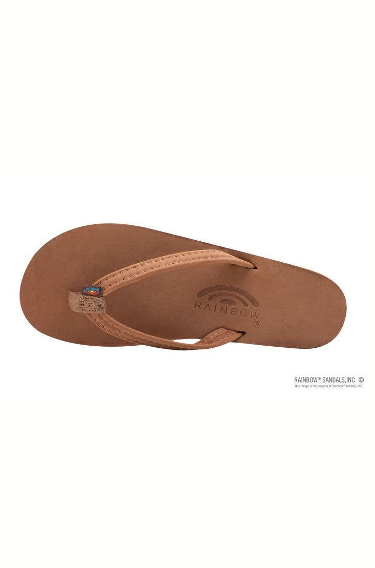A single Premier Leather Redwood Single Layer Arc flip-flop by Rainbow Sandals, viewed from above, features a simple strap and an embossed RAINBOW logo with rainbow design on the nubuck leather footbed.