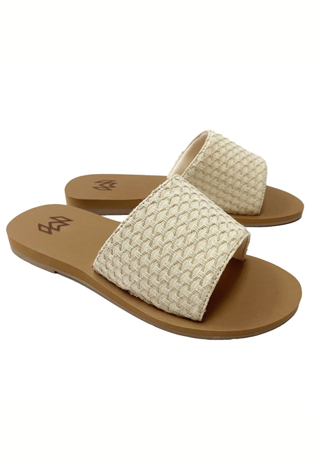 The Malvados Ellie 2- Hampton beige woven slide sandals feature wide textured straps, tan flat soles, and a memory foam footbed for comfort, shown against a white background.