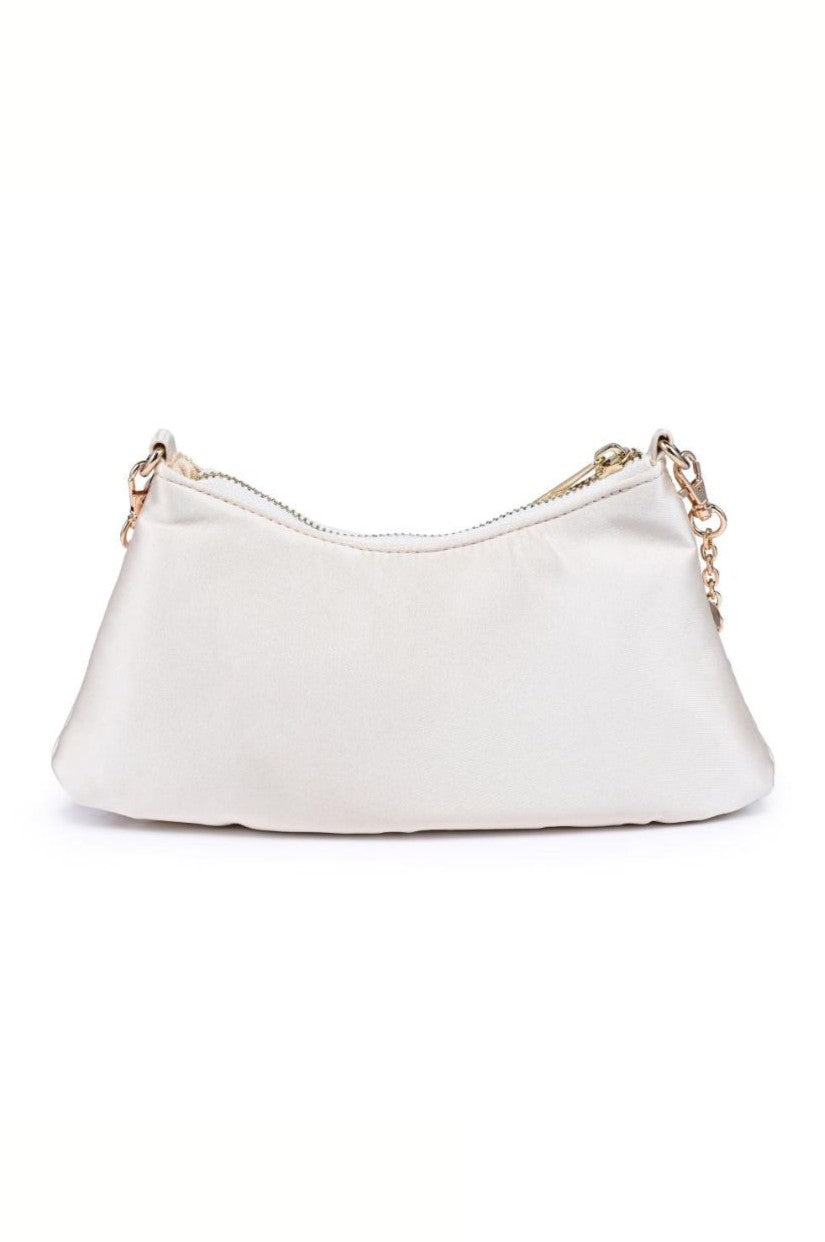 The Opalite Shell Purse by Urban Expressions is a small white satin clutch with a curved shape, top zipper, and removable gold chain strap, shown on a plain white background.