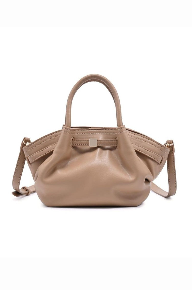 The Selena Mini Crossbody by Urban Expressions in NATURAL features an adjustable strap, short handles, a soft gathered design, and a small rectangular metal accent for an elegant touch to your everyday style.