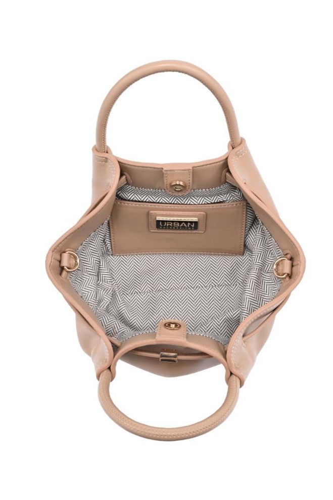 The Selena Mini Crossbody by Urban Expressions features tan adjustable straps, round handles, and an open interior lined with black and white herringbone fabric, plus a pocket labeled URBAN.