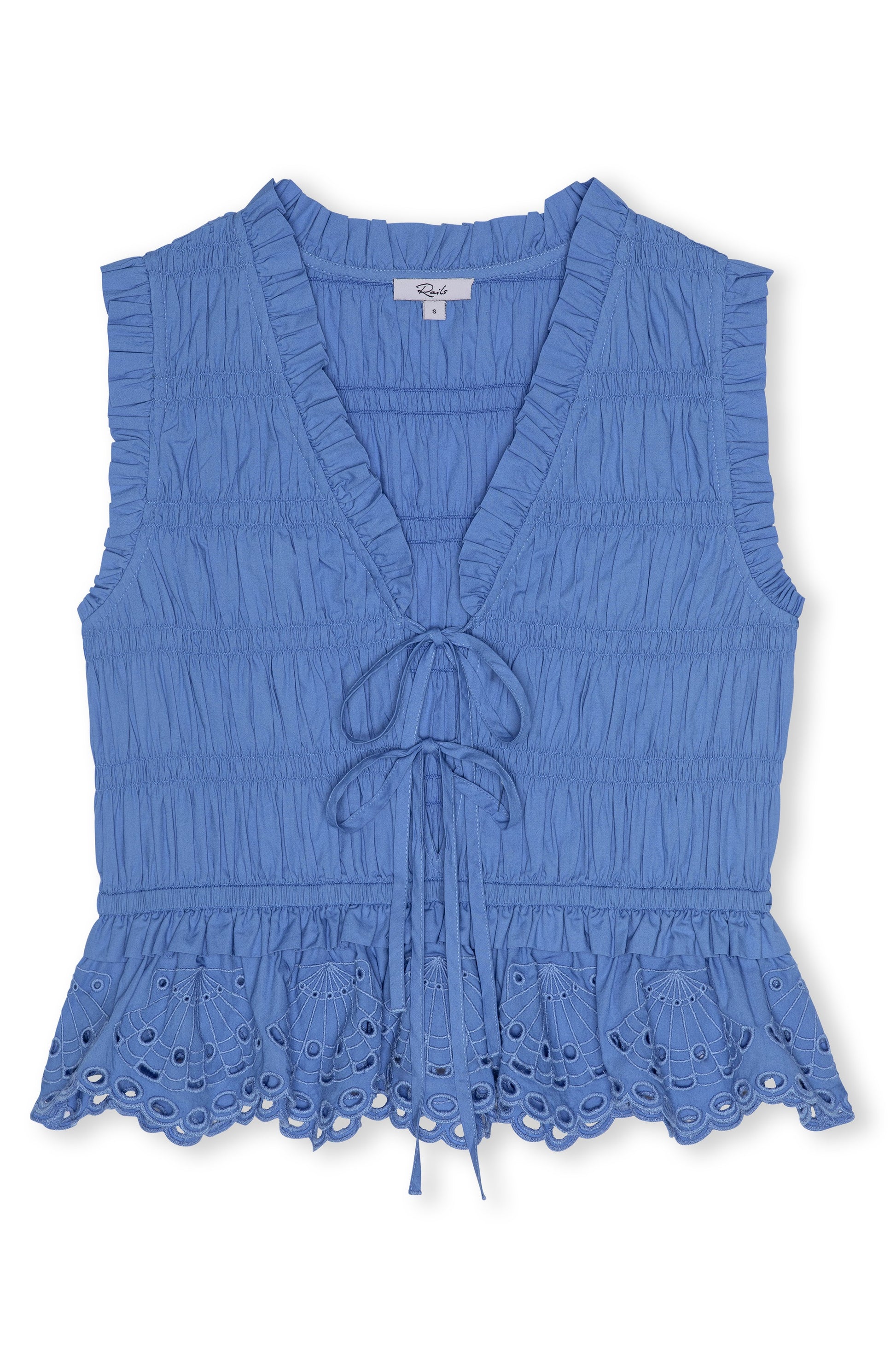 The Martine Sleeveless Top by Rails features a blue cotton poplin fabric, ruffled V-neck with tie-front, eyelet lace hem, and a flattering peplum silhouette.
