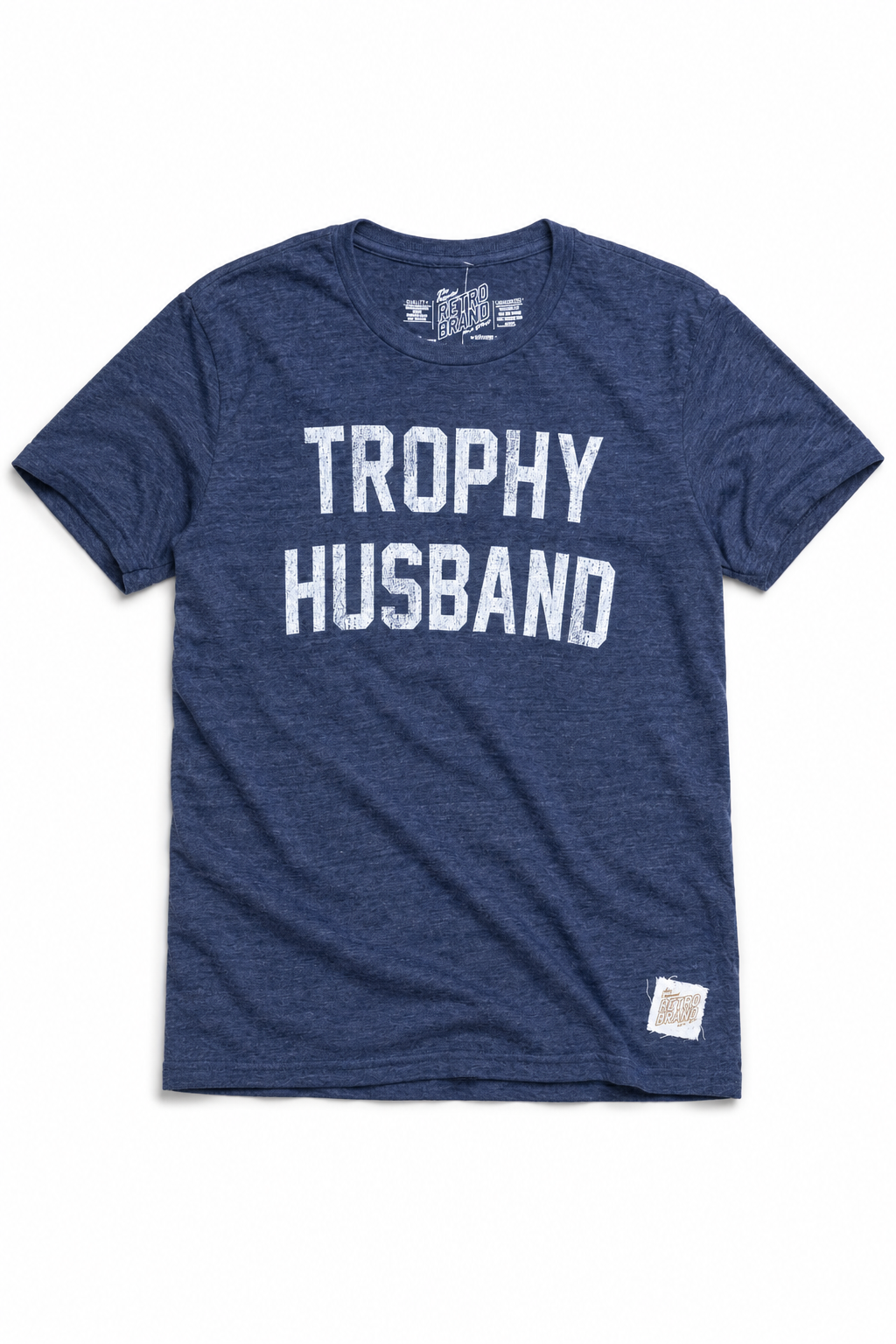The Trophy Husband unisex tri-blend tee by Original Retro Brand in STREAKY NAVY features bold, distressed “TROPHY HUSBAND” text and a patch near the hem. Enjoy ultimate comfort with this super soft t-shirt.