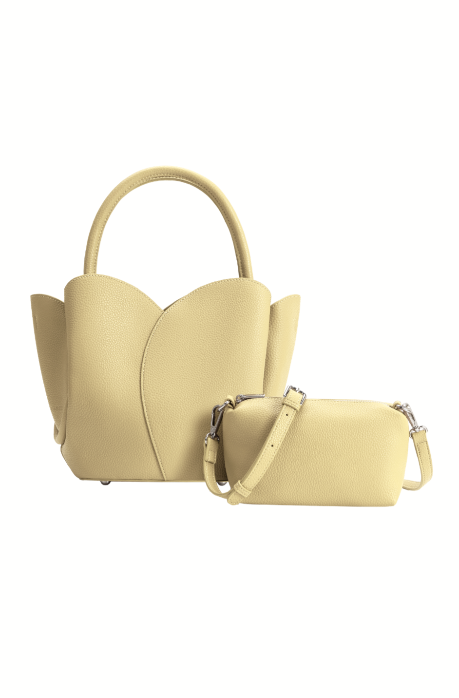 The Tulip Purse by Melie Bianco is a stylish pale yellow bag with a petal-inspired design, crafted from recycled vegan leather. It includes a crossbody strap and a matching removable textured vegan leather zip pouch.
