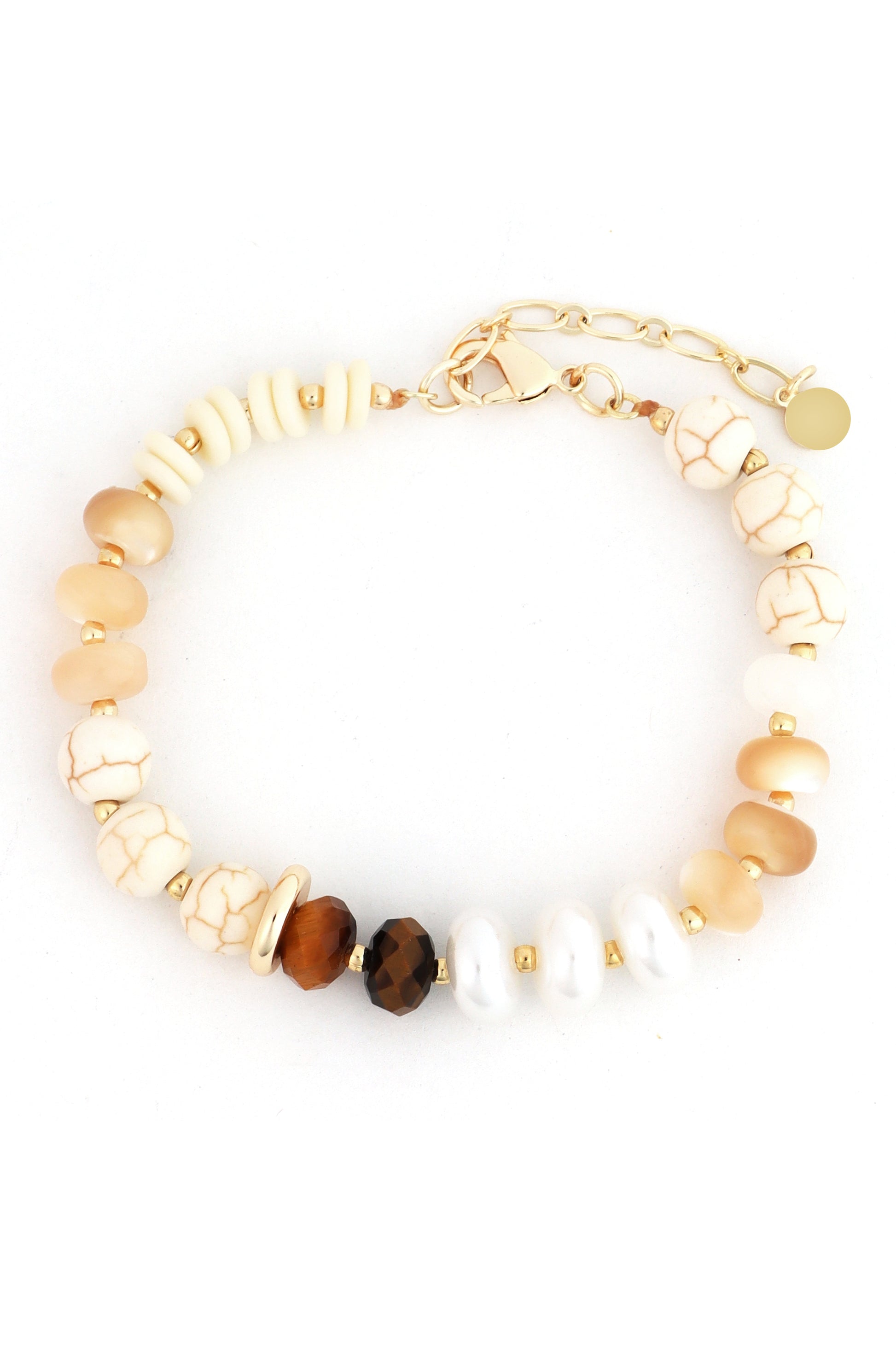 The Stone and Crystal Beaded Bracelet by South Moon Under features cream, brown, and white stones—some howlite—with gold spacers and chain clasp. Its varied bead shapes create an elegant, natural look for crystal bracelet lovers.