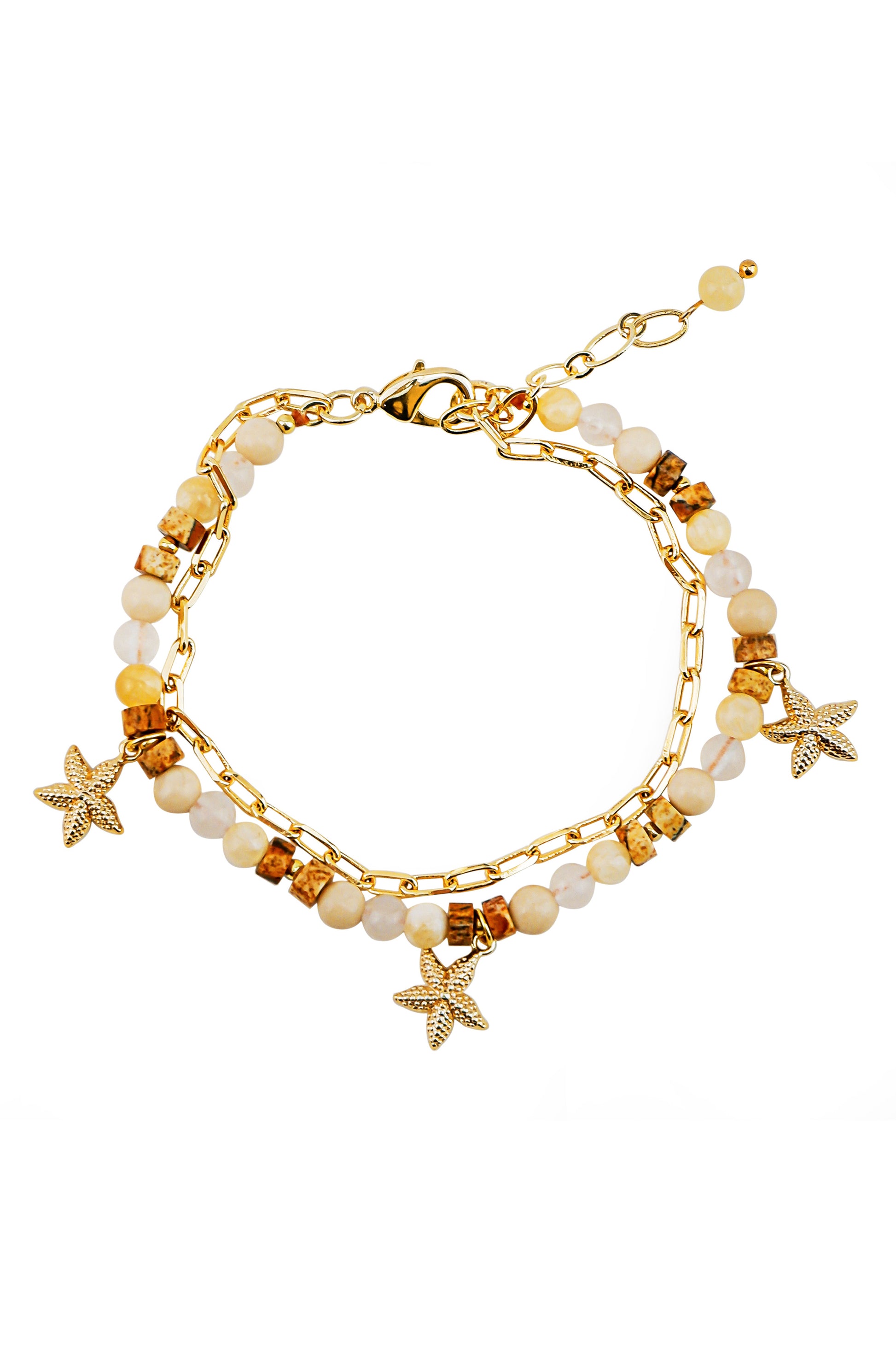 The South Moon Under Stone and Chain Starfish Bracelet features white and gold mother of pearl beads, delicate gold starfish charms, and an adjustable clasp.