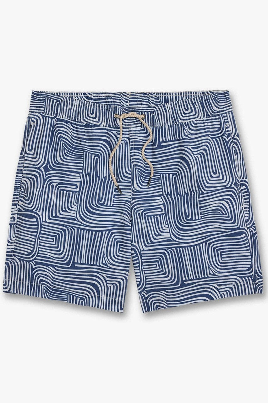 The Fair Harbor Bayberry Trunk 7 Inch Wavy Sands swim shorts feature a blue and white wavy pattern, recycled polyester, BreezeKnit liner, elastic waistband with beige drawstring, and a comfy 7-inch inseam.