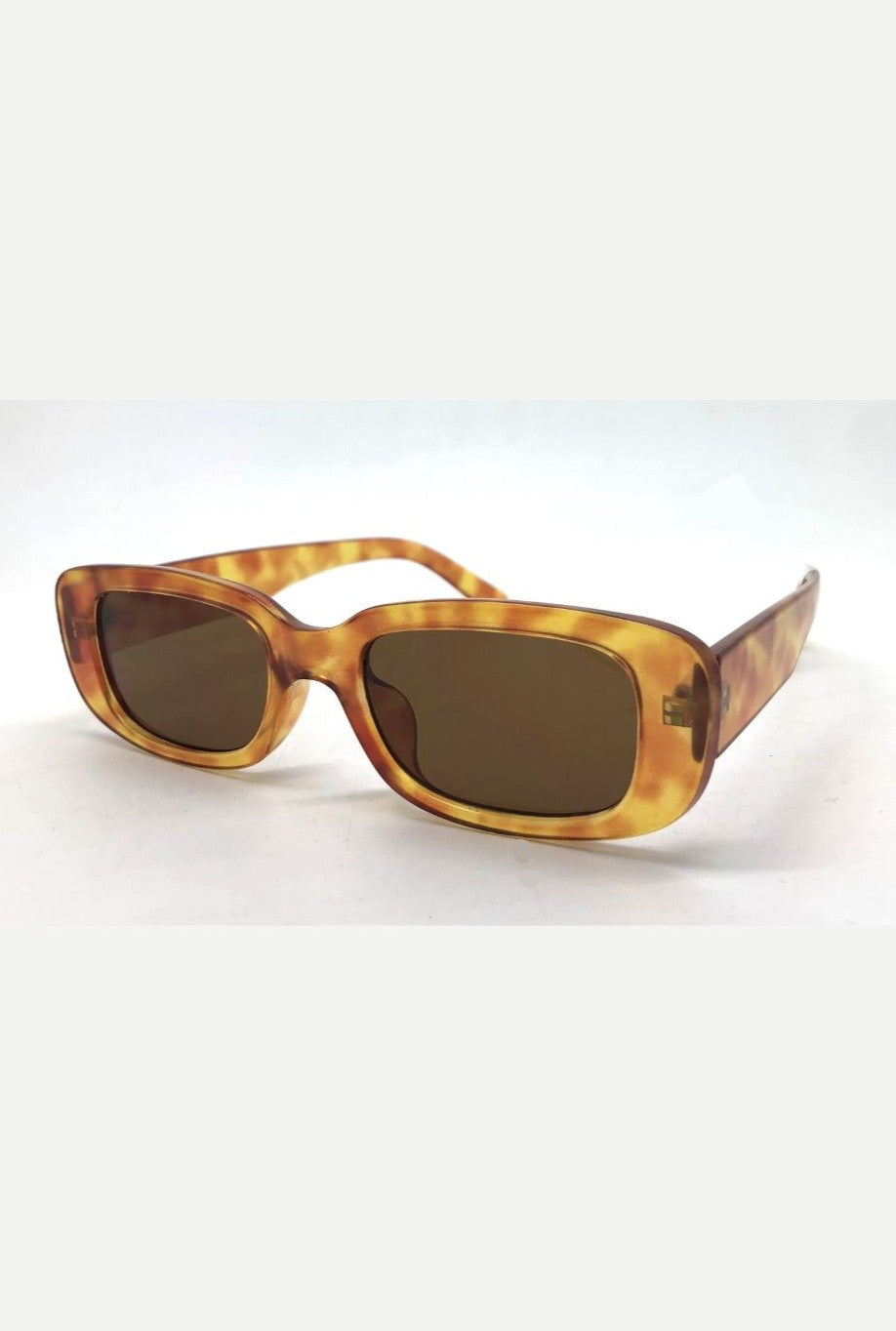The Catwalk Sunnies by South Moon Under are rectangular sunglasses with brown multi tortoiseshell plastic frames, dark monotone lenses, and 100% UV protection, shown on a plain white background.