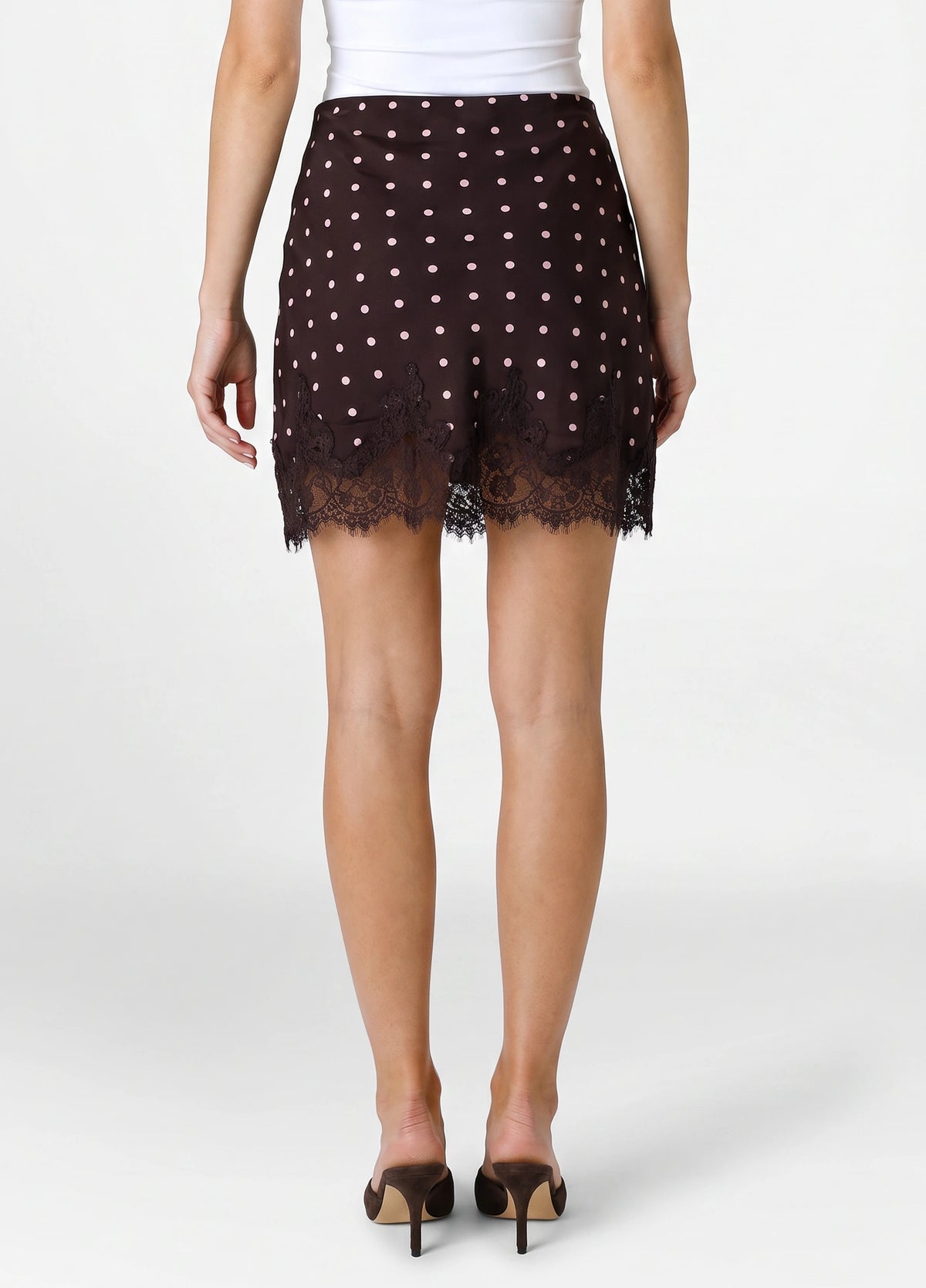 Brown mini skirt with white polka dot pattern and black lace trim hem.