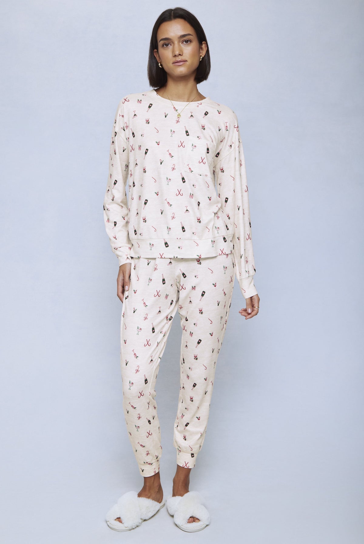 Cream jersey set with burgundy and black cocktail-themed print throughout long-sleeve top and tapered pants.