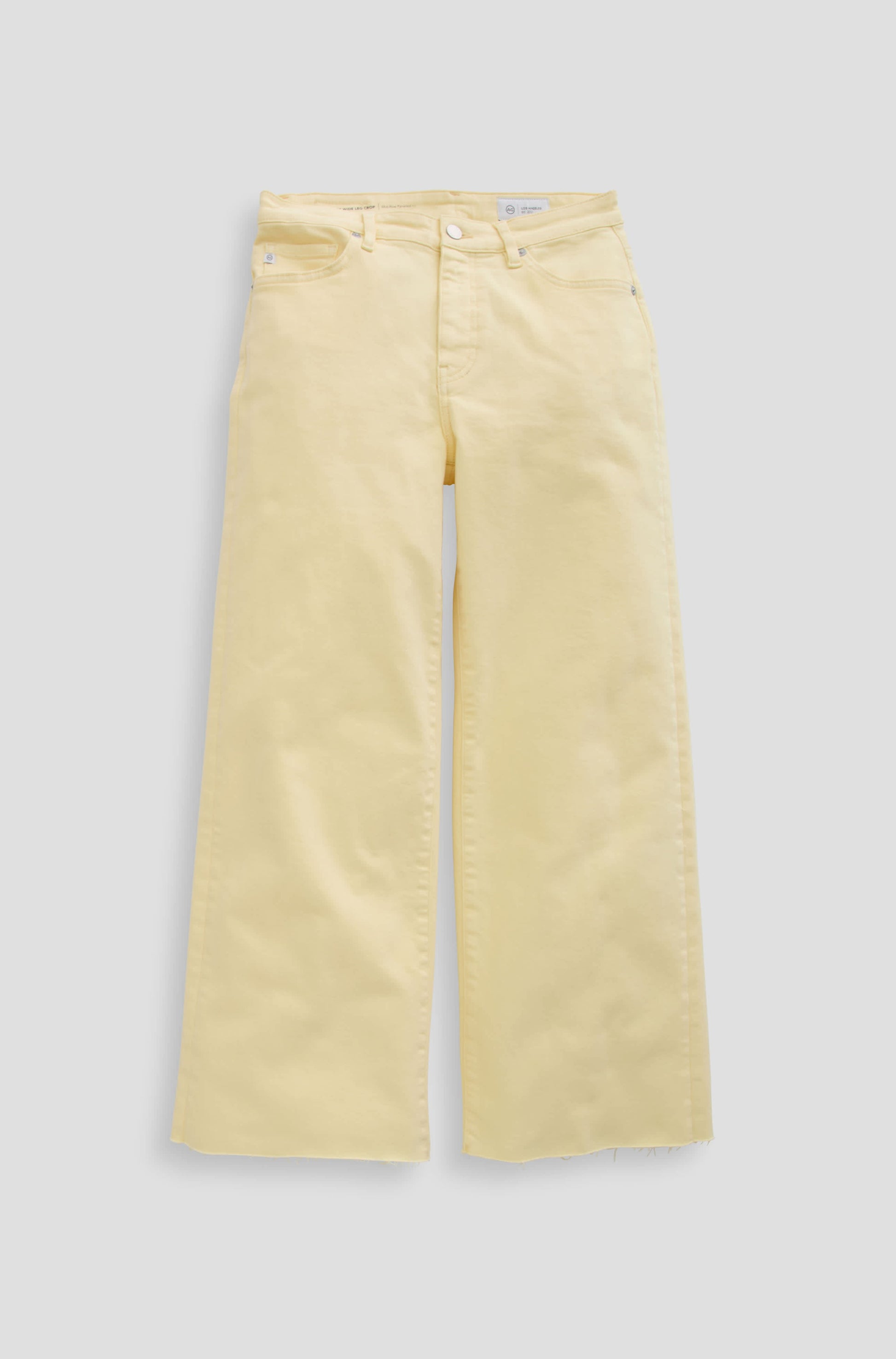 The Saige Wide Leg Crop by AG Jeans is a high-waisted, sunlight yellow jean in cloud soft denim with front and back pockets, shown flat on a light gray background.