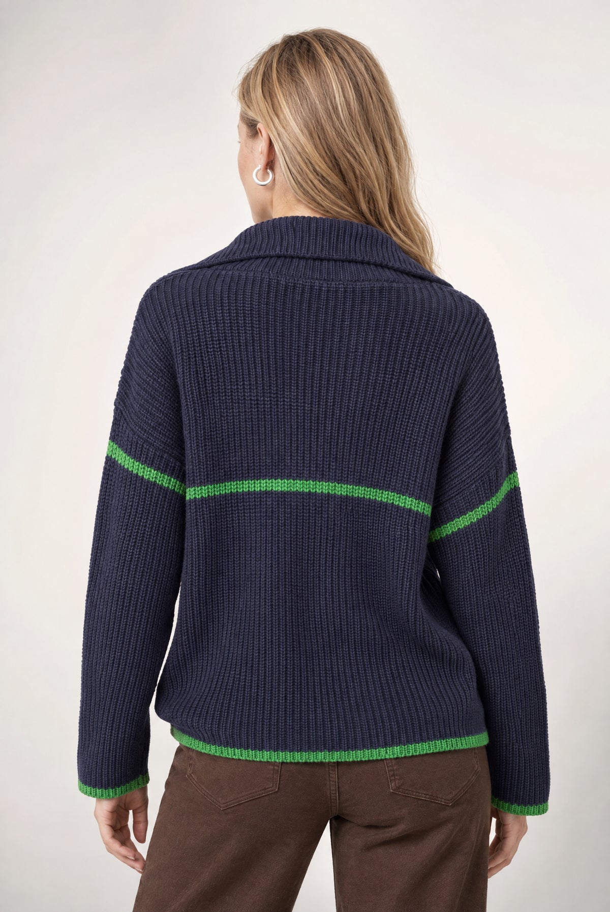 Navy ribbed half zip sweater with bright green contrast trim on collar, cuffs, and hem.