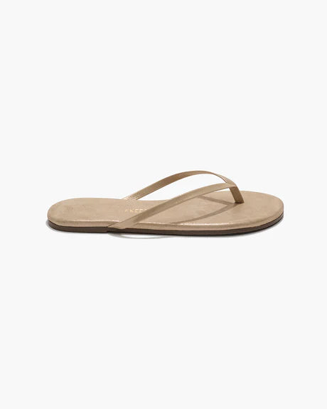 A single Tkees Glitters flip-flop sandal in Pink Pearl with a leather upper, thin straps, and flat sole is displayed on a plain white background.