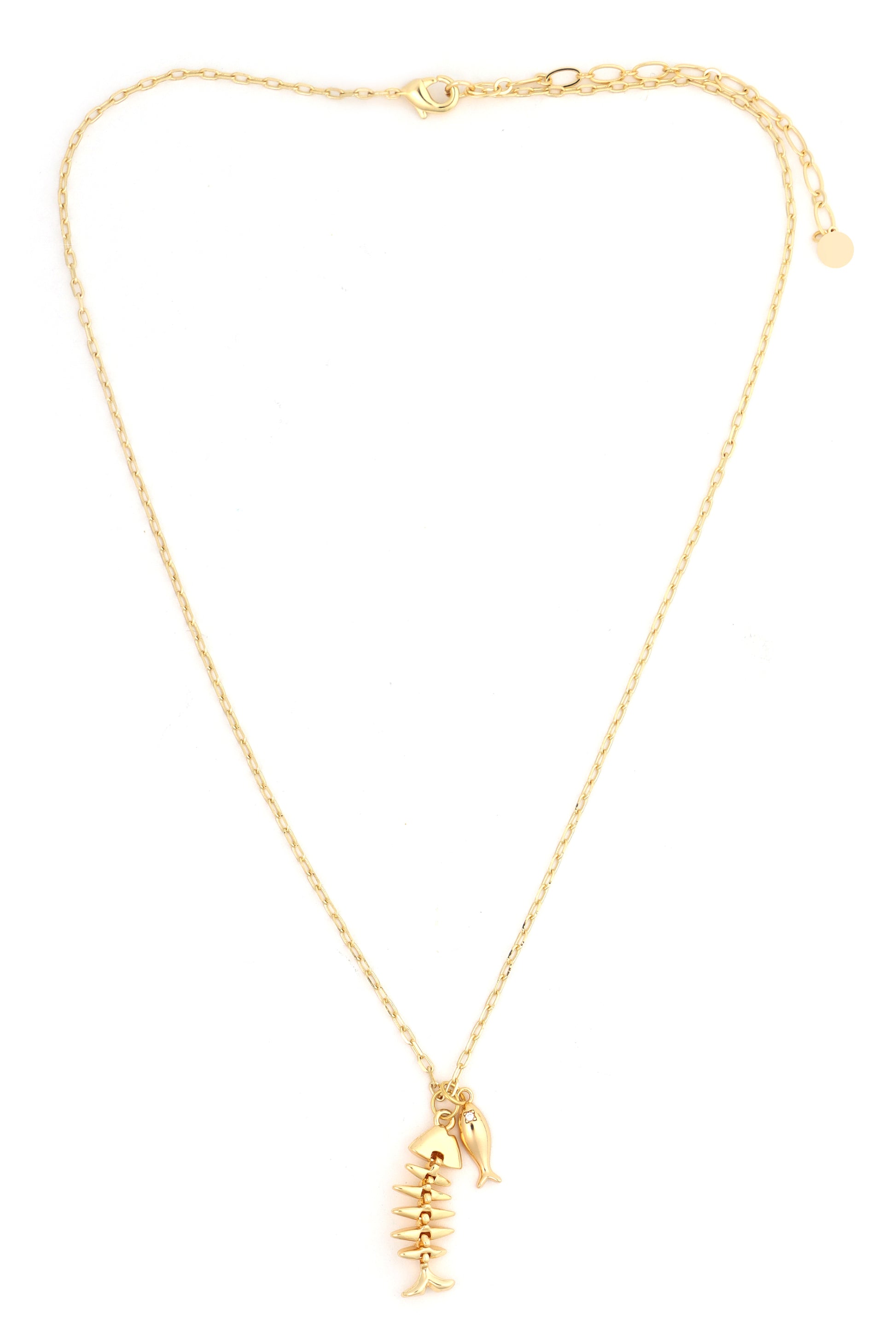 The South Moon Under Boney Fish Charm Pendant Necklace in gold features two pendants—a small fish and a fish skeleton—side by side. This elegant gold necklace is shown against a white background.