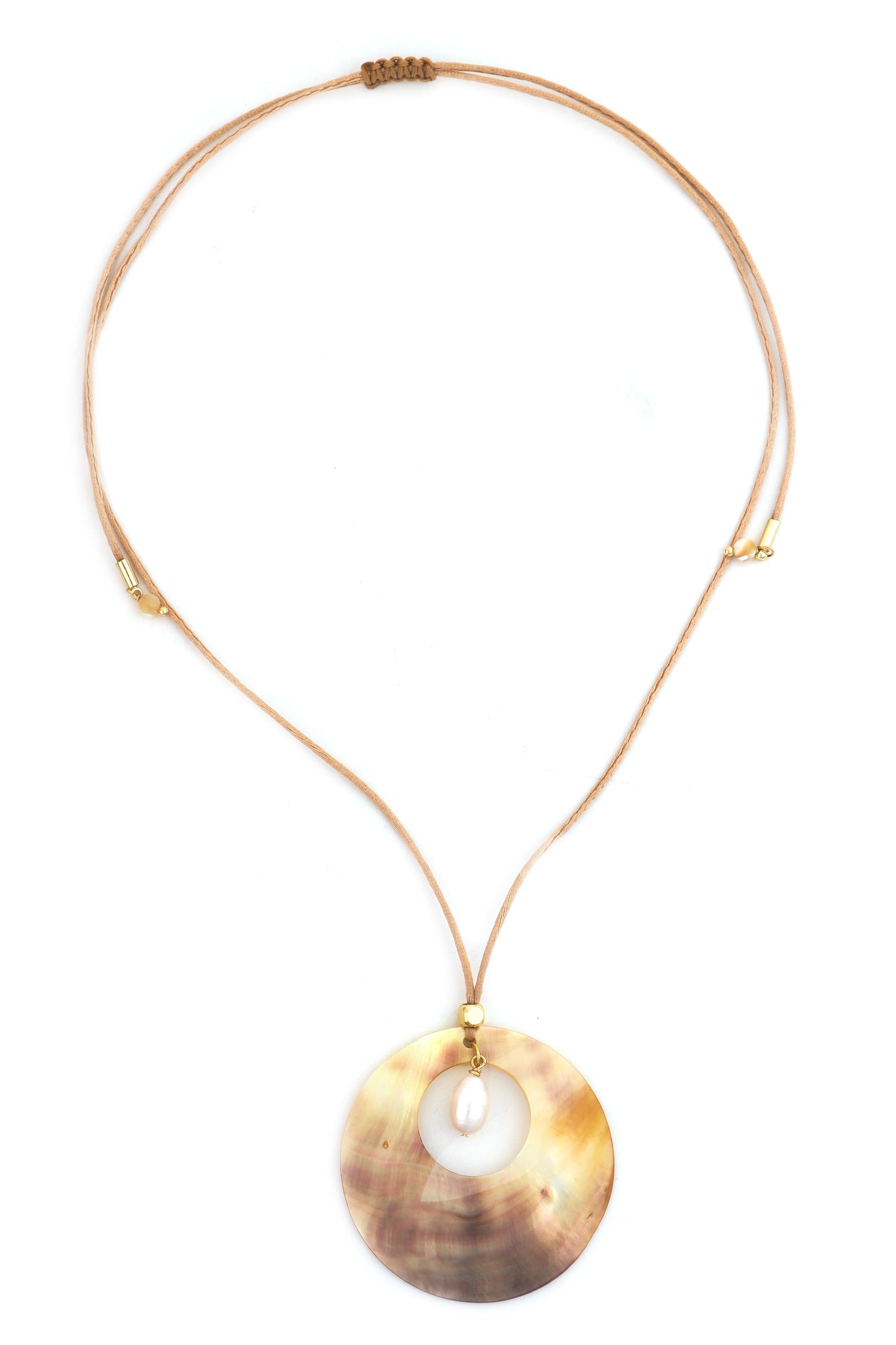 The South Moon Under Shell Side Pendant Necklace features a gold-tone adjustable slide design with a large iridescent shell pendant and a small white bead for an elegant touch.