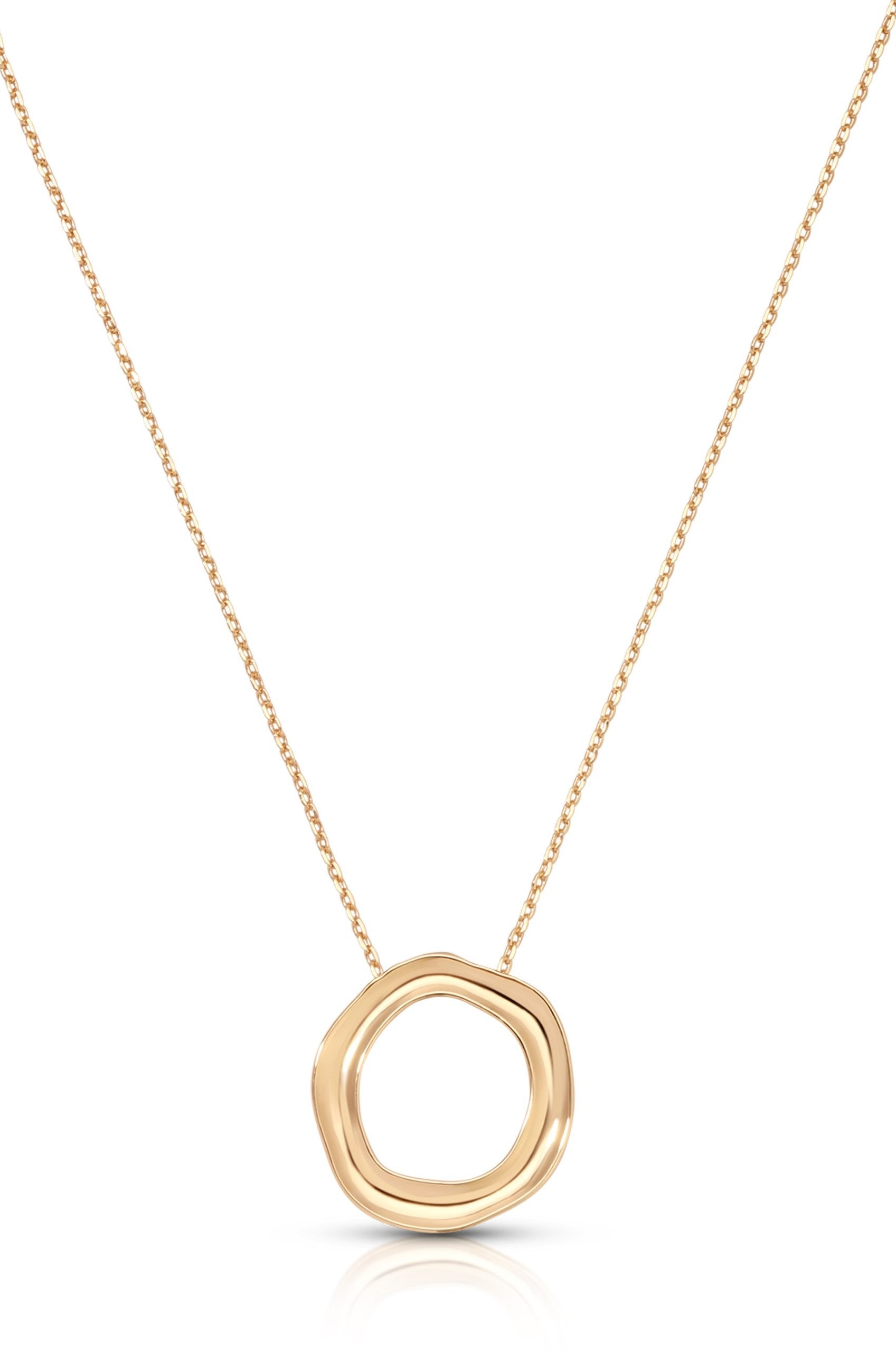 The Ettika Mini Open Circle Necklace features a minimalistic, modern design with a delicate gold finish and an organically shaped open circle pendant at its center.
