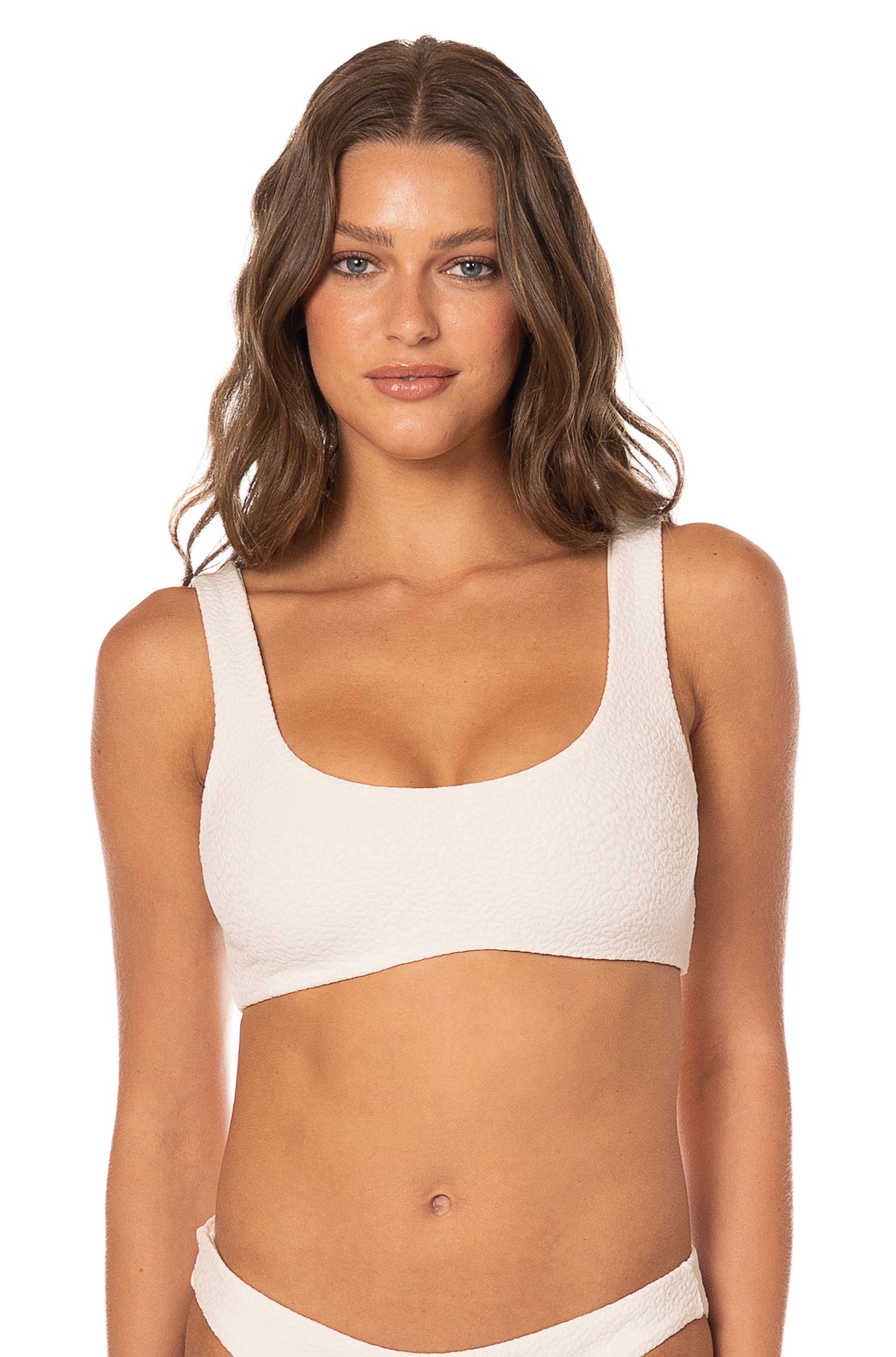 A woman with long, wavy brown hair wears the Maaji Coconut Milk Dazzle Top bikini against a plain white background, facing the camera with a neutral expression.