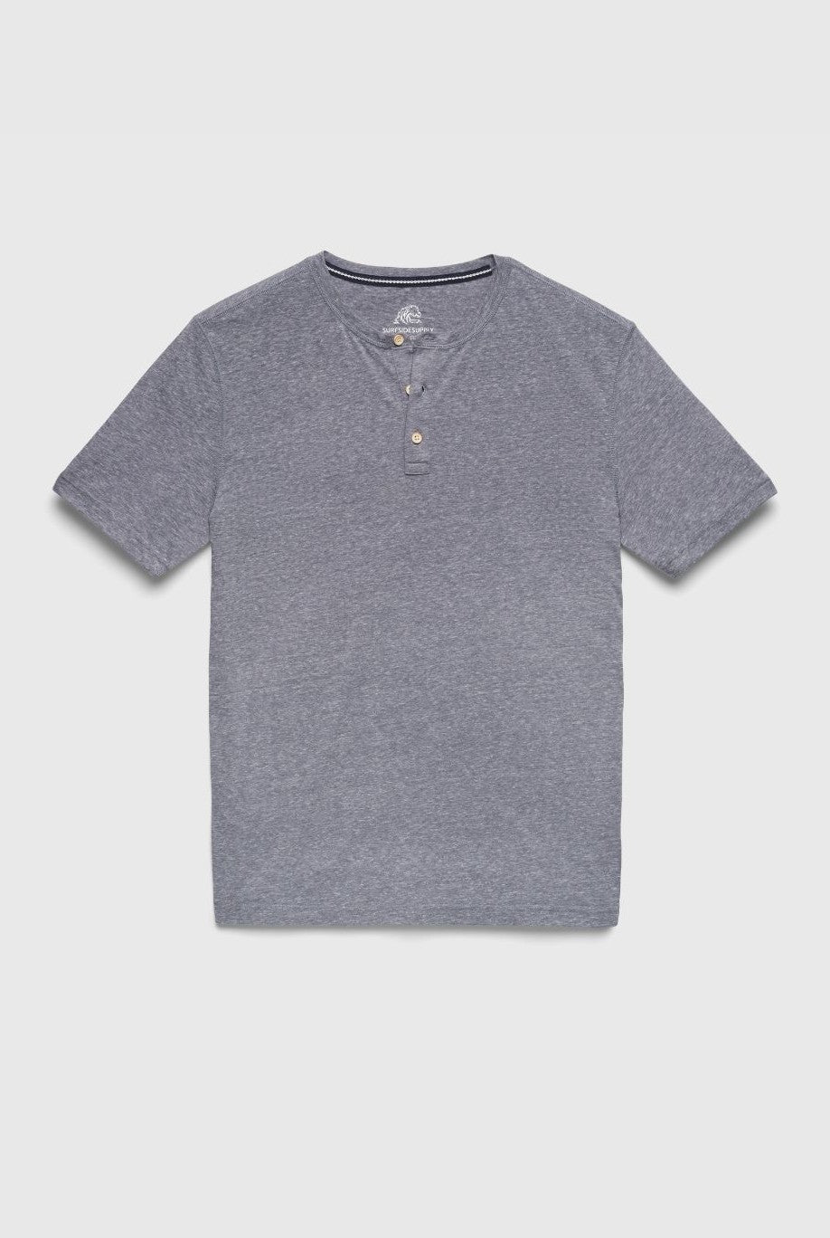 The Surfside Supply Co. Sean Short Sleeve Single Dye Jersey Henley in navy features a round neckline, two buttons, and short sleeves, shown flat on a light gray background.