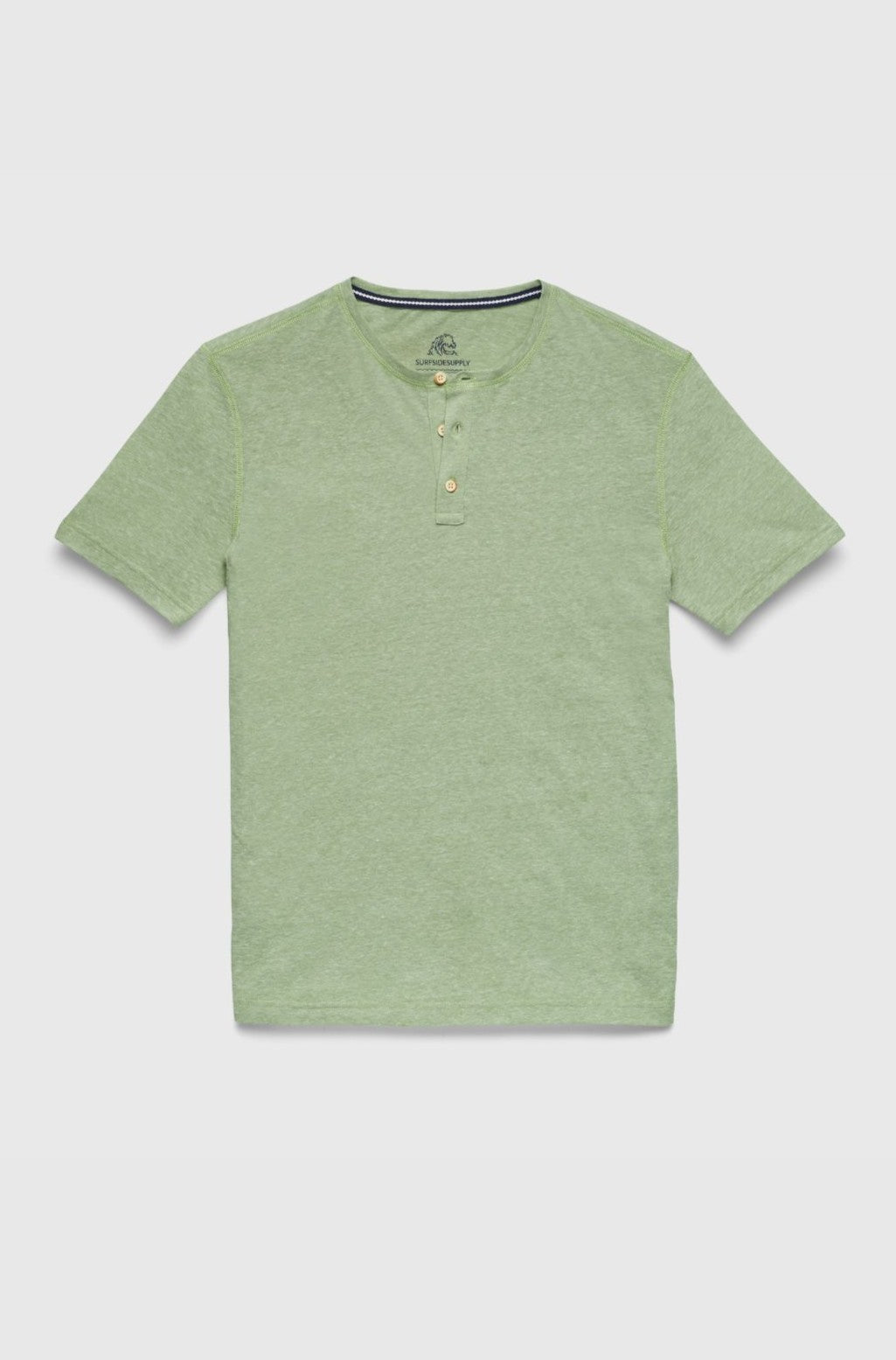 The Sean Short Sleeve Single Dye Jersey Henley by Surfside Supply Co. is a green regular fit shirt with a crew neckline, two-button placket, and made from recycled polyester, shown laid flat on a white background.