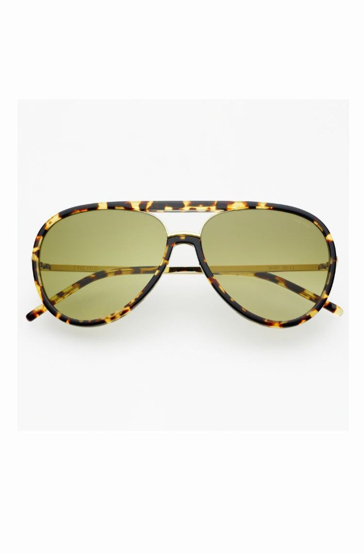 Shay Sunnies by South Moon Under are tortoiseshell aviator sunglasses for women with green-tinted lenses, a classic double bridge, and 100% UV protection. Shown on a plain white background.