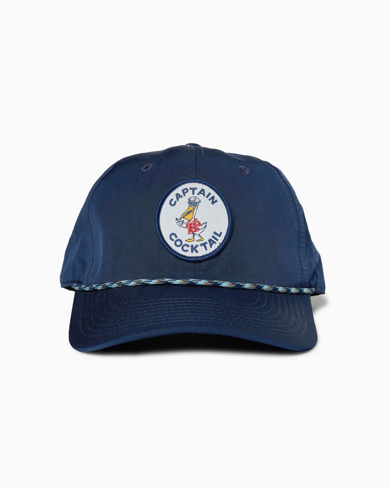 The Captain Cocktail Hat by Toes on the Nose is a navy 5 panel unstructured cap with a duck and “CAPTAIN COCKTAIL” patch, braided rope detail, and an adjustable snapback for the perfect fit.