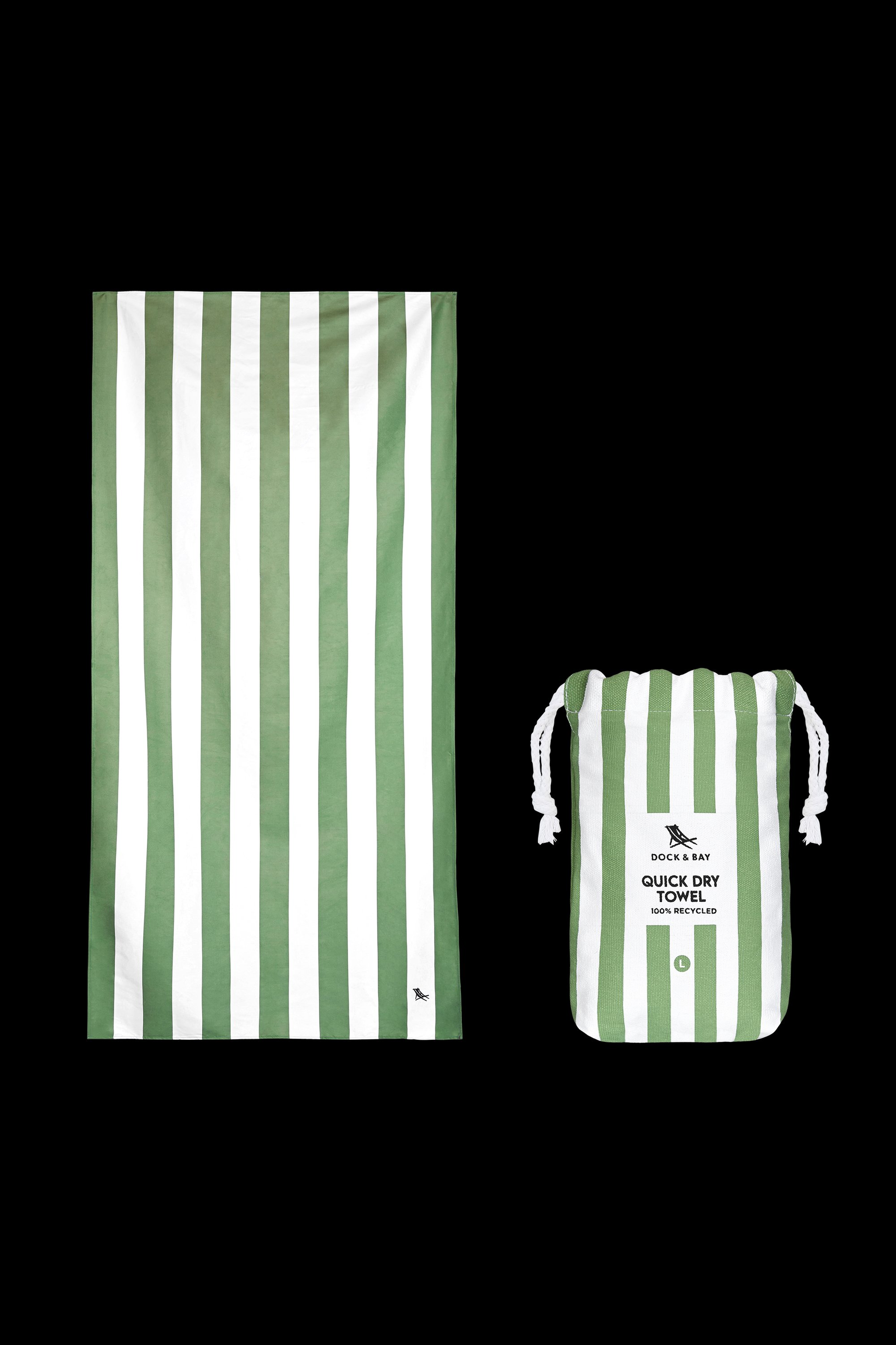 A South Moon Under Cayman Olive Stripe Towel in Green Multi is shown beside a matching drawstring bag, both featuring vertical stripes. The items are displayed against a black background.
