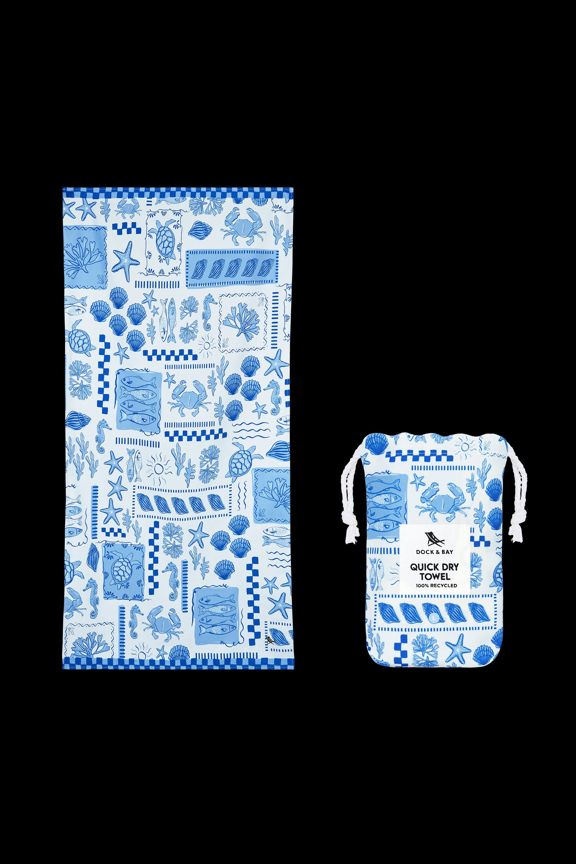 The South Moon Under Grecian Shores Large Towel, a blue and white microfiber towel with coastal sea creature and plant patterns, is shown alongside its matching Quick Dry Towel pouch. Both are lightweight and dry quickly.