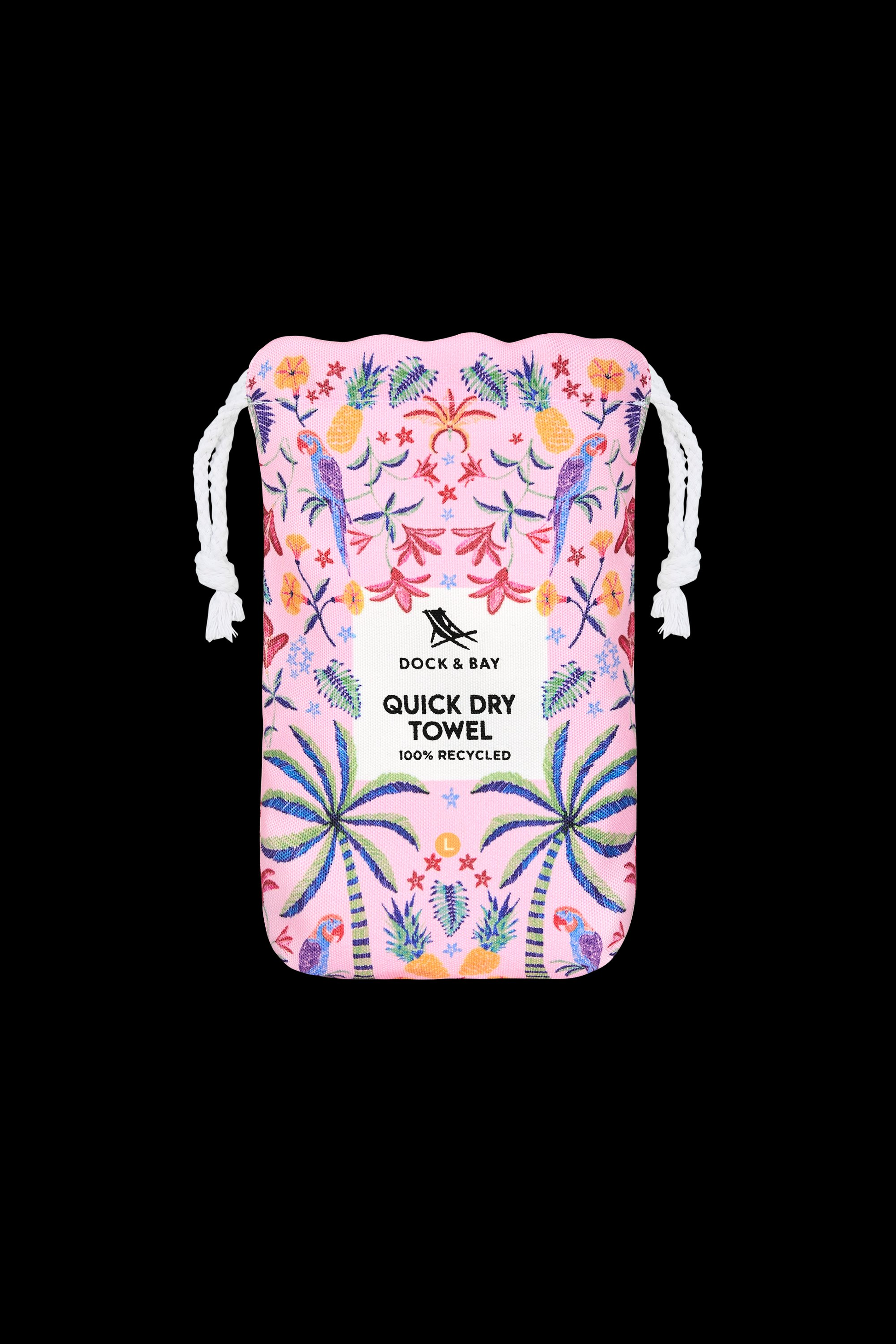 A pink drawstring pouch with tropical patterns holds the South Moon Under Pink Paradise Large Towel, a quick-dry microfiber beach towel made from 100% recycled materials.
