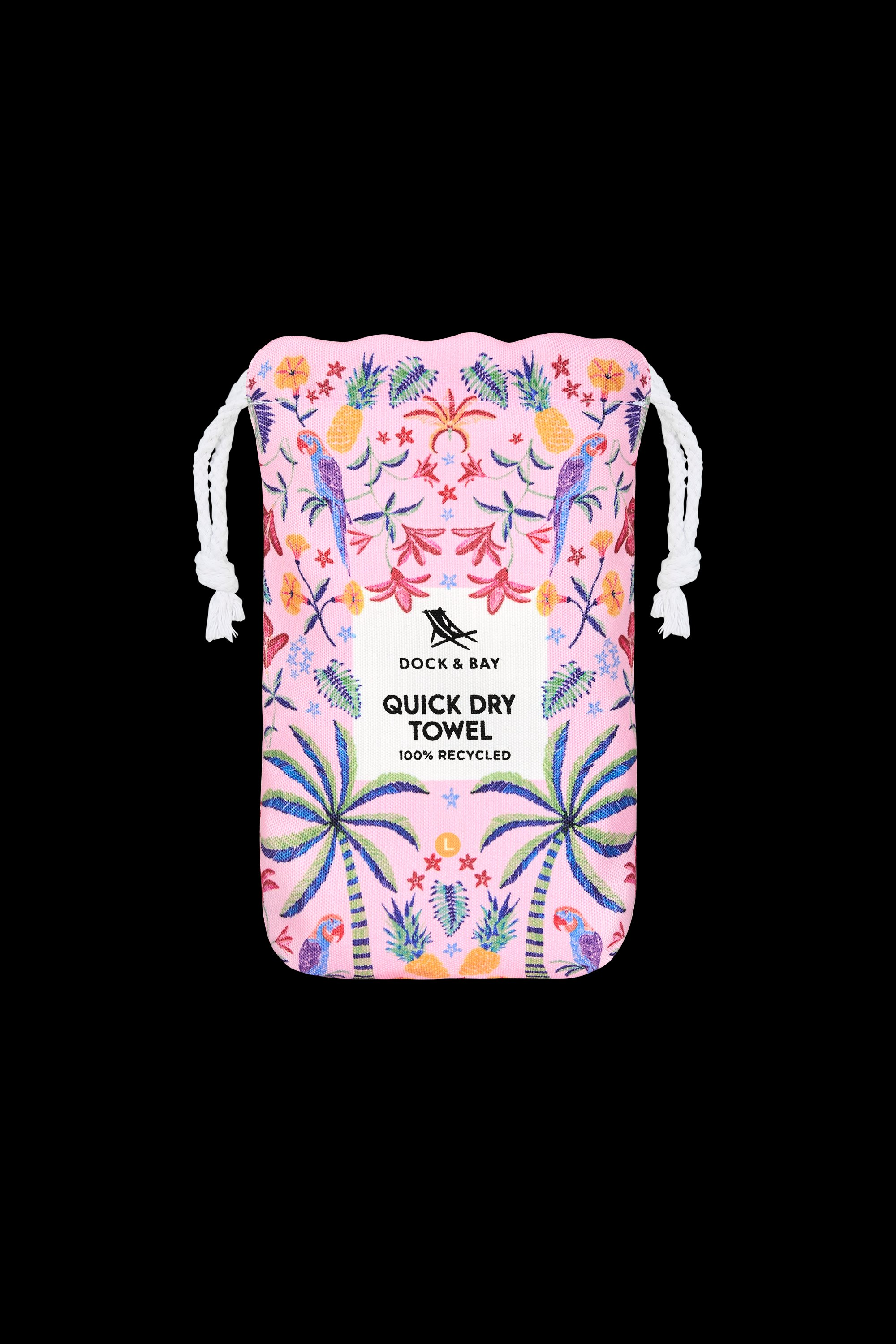 A pink drawstring pouch with tropical patterns holds the South Moon Under Pink Paradise Large Towel, a quick-dry microfiber beach towel made from 100% recycled materials.