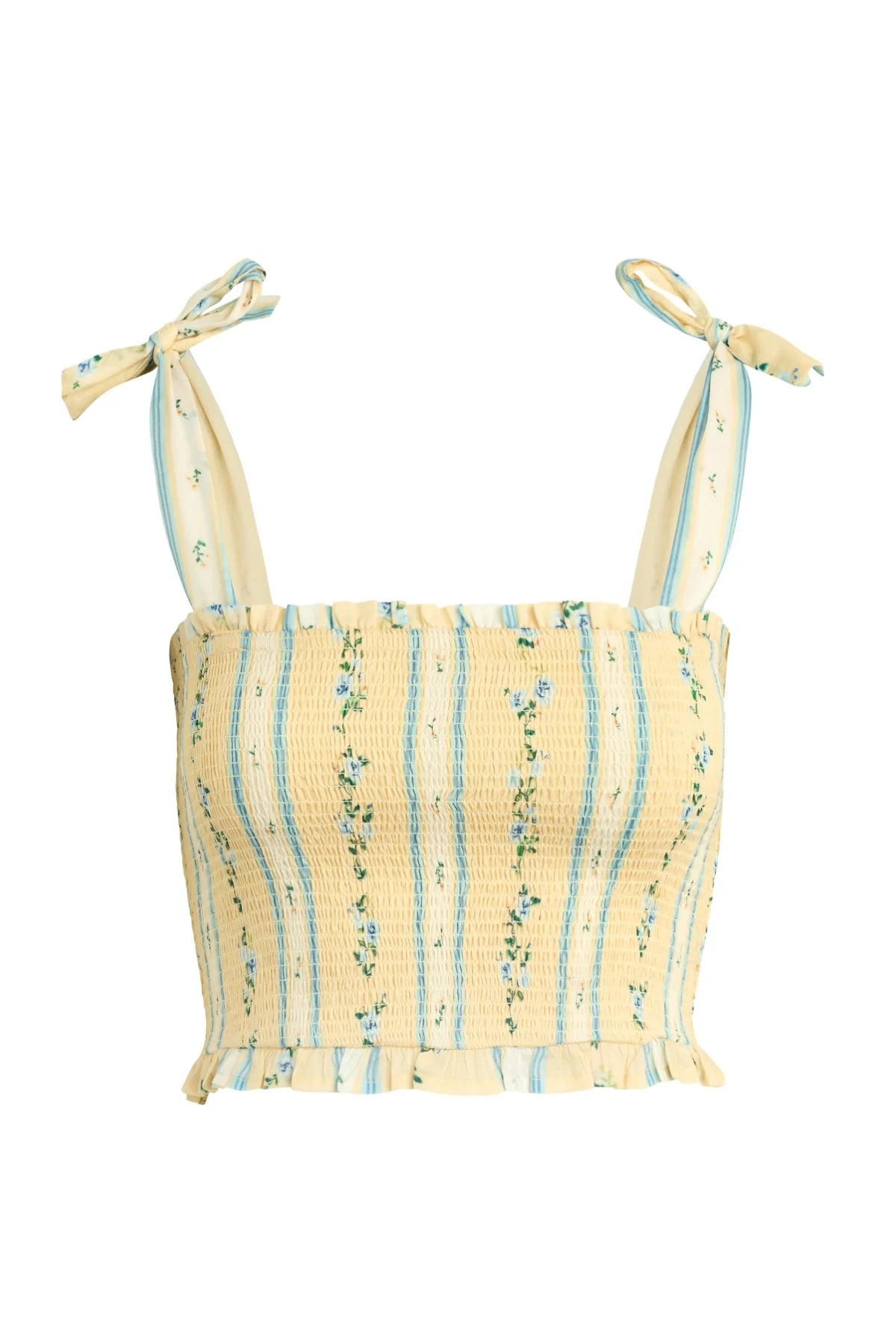 The Tessa Top by Bila 77 is a sleeveless, cropped yellow multi smock crop top with blue vertical stripes, small floral patterns, adjustable tie shoulders, and a ruffled hem.
