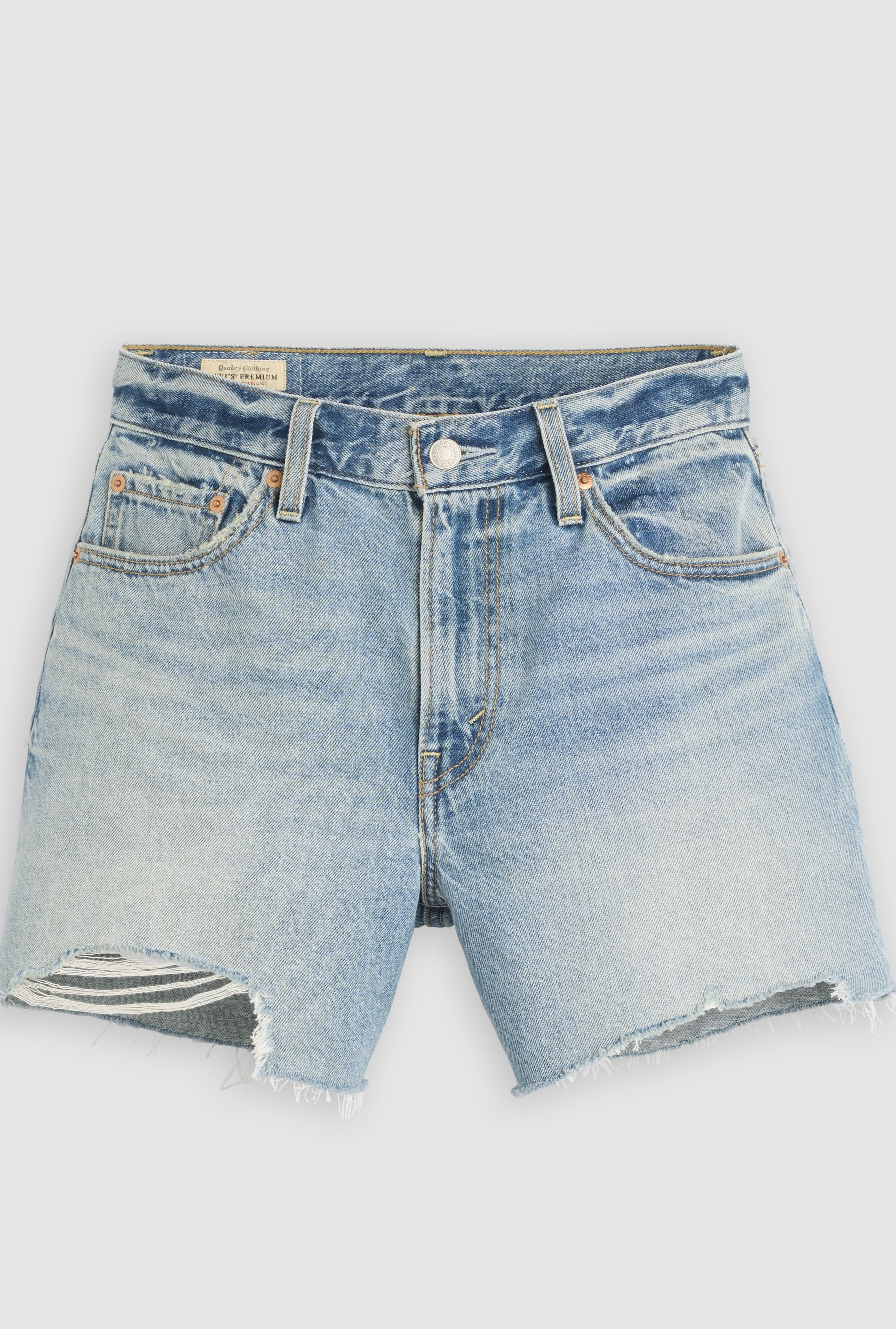 The Levi's Ribcage Short Zip Blow My Mind features light blue 100% cotton denim with frayed hems, a small rip on the left leg, front and back pockets, button closure, and visible stitching. The mid-rise shorts are shown laid flat.