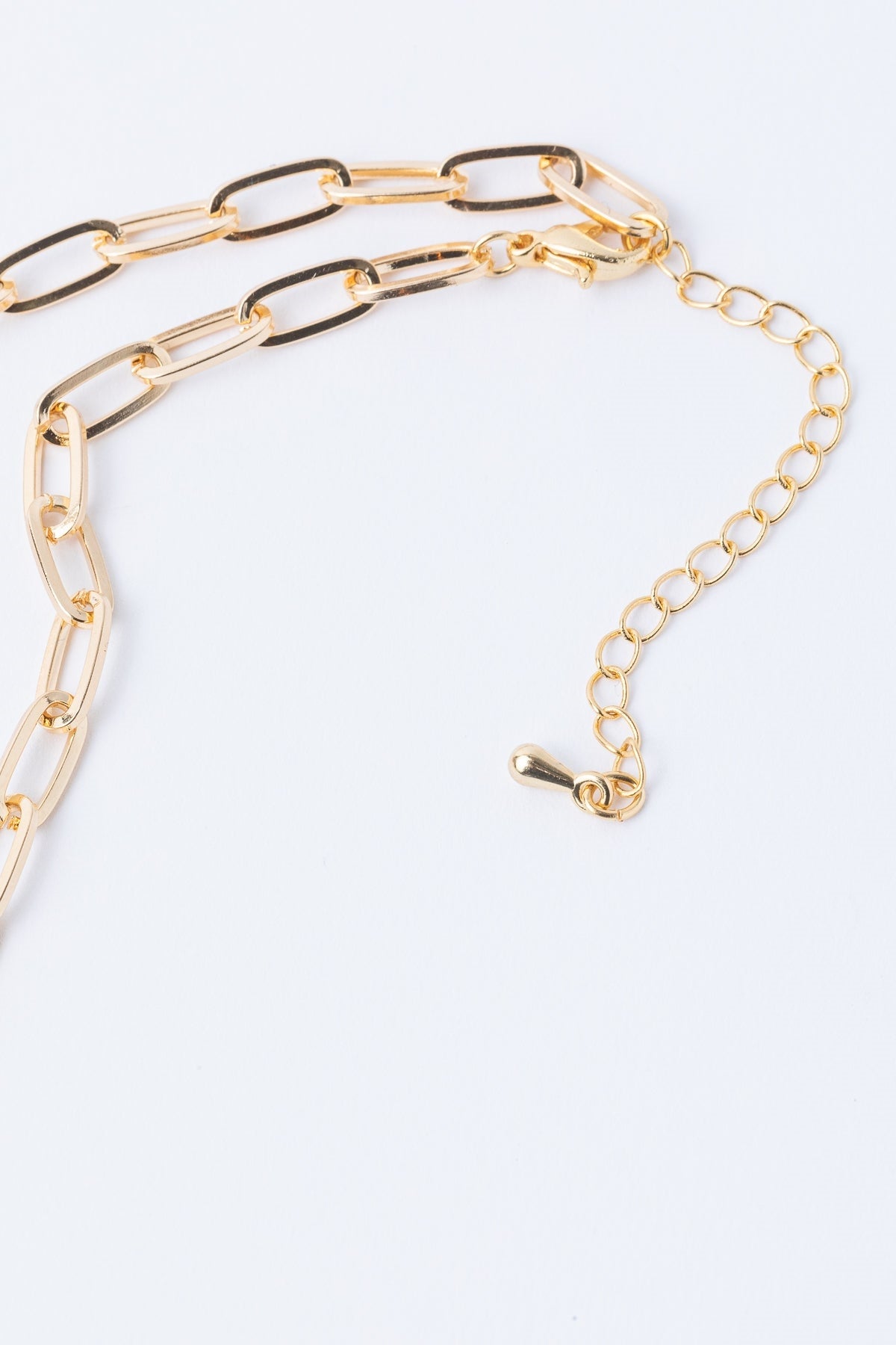 The South Moon Under Gold Chain Link Short Necklace, featuring large rectangular gold links and an adjustable extender clasp, is shown on a white background.