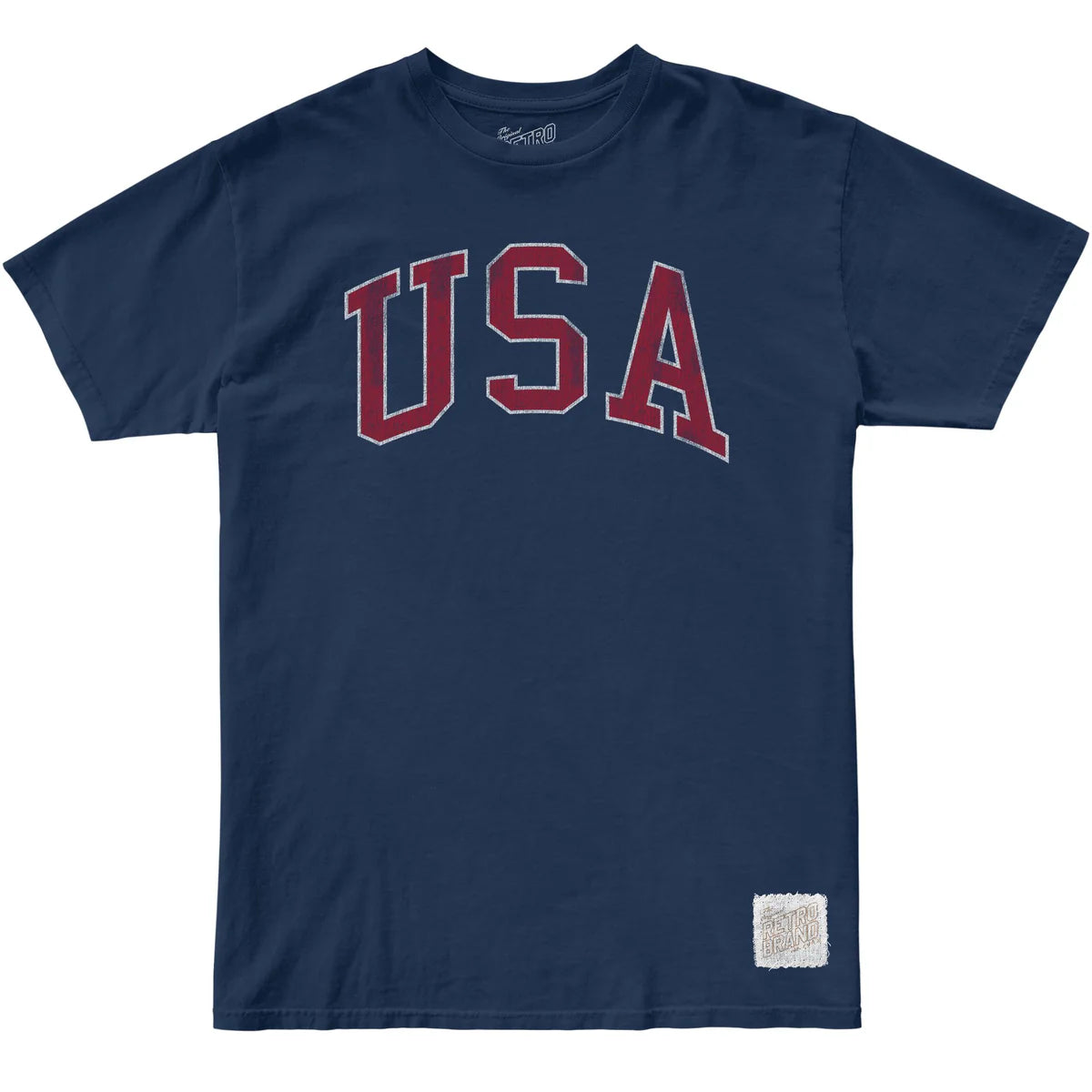 The USA Arch Tee by Original Retro Brand is a navy cotton unisex t-shirt with bold red "USA" letters outlined in white on the chest and a small patch near the hem, blending ultra-soft comfort with classic style.