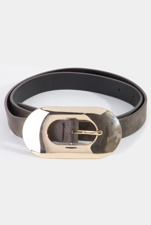 A brown Staple Belt by South Moon Under with a slim design and a large, shiny gold buckle featuring a metallic finish, displayed against a light gray background.
