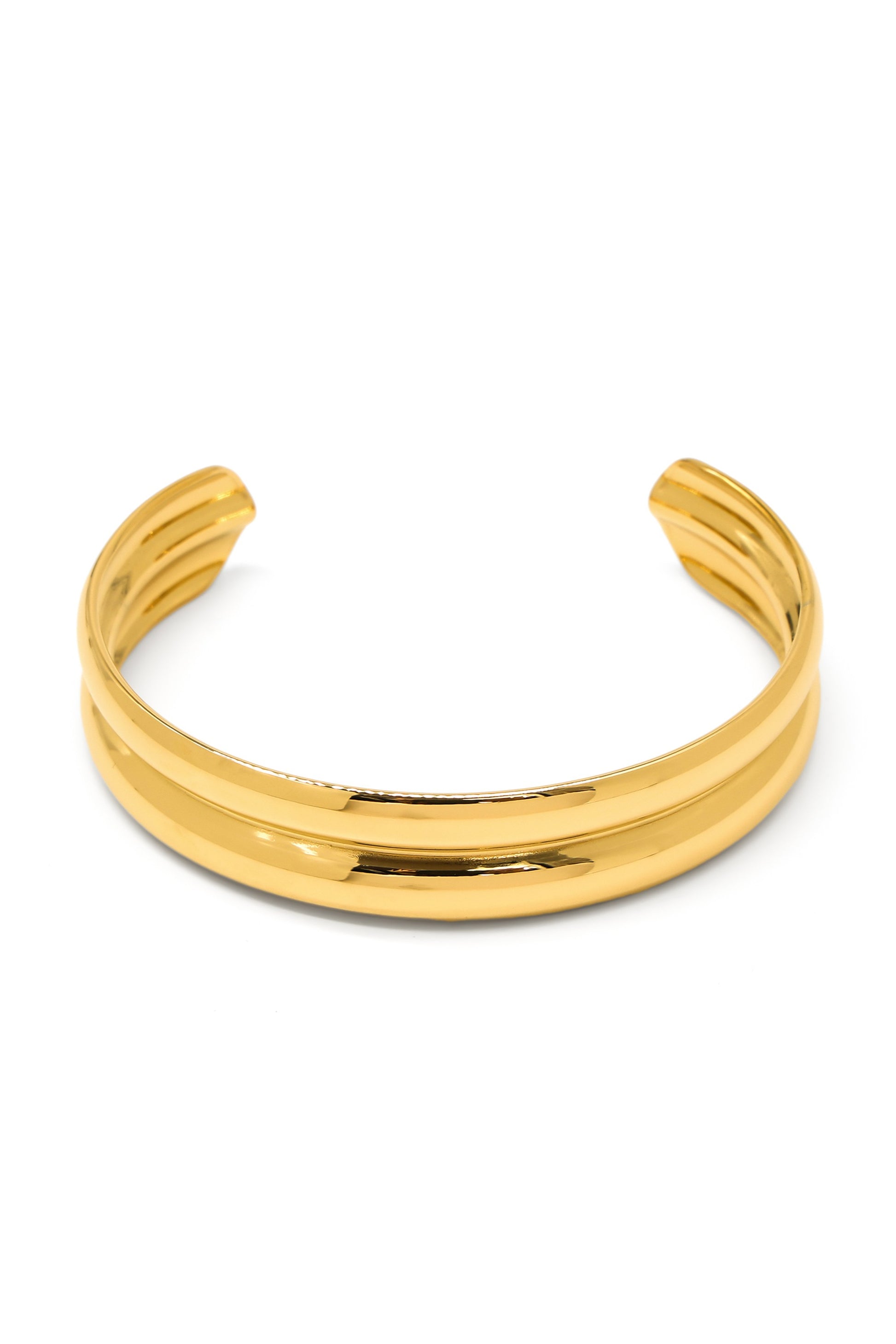 The South Moon Under Gold Bangle features a shiny double-band brass design, model HTB-1340GD, with an open back for adjustable fit, shown on a white background.