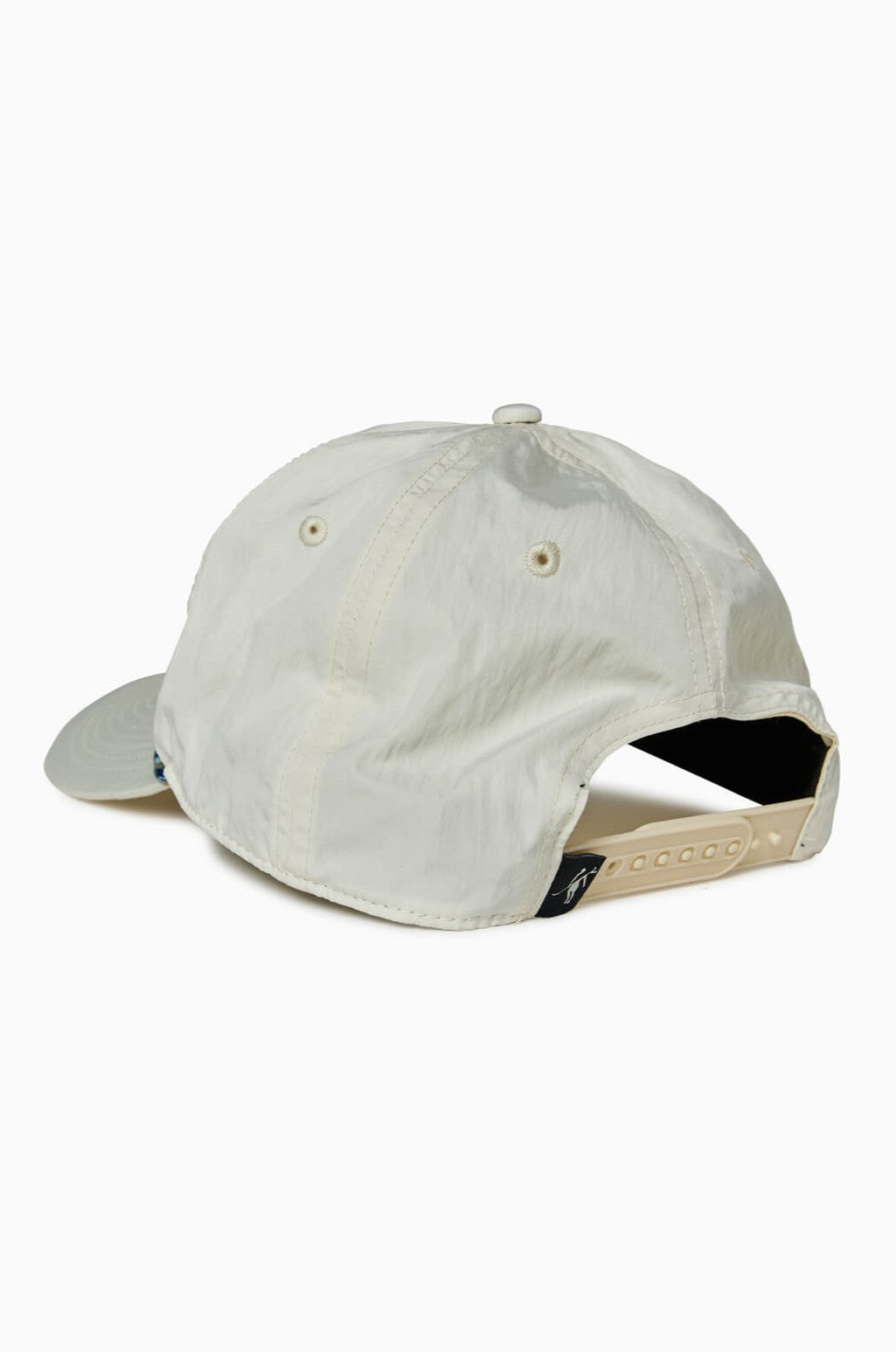 The Toes on the Nose Captain Cocktail Hat is a light beige, 5-panel unstructured cap with a curved brim, ventilation eyelets, and an adjustable beige snapback strap shown from the back.
