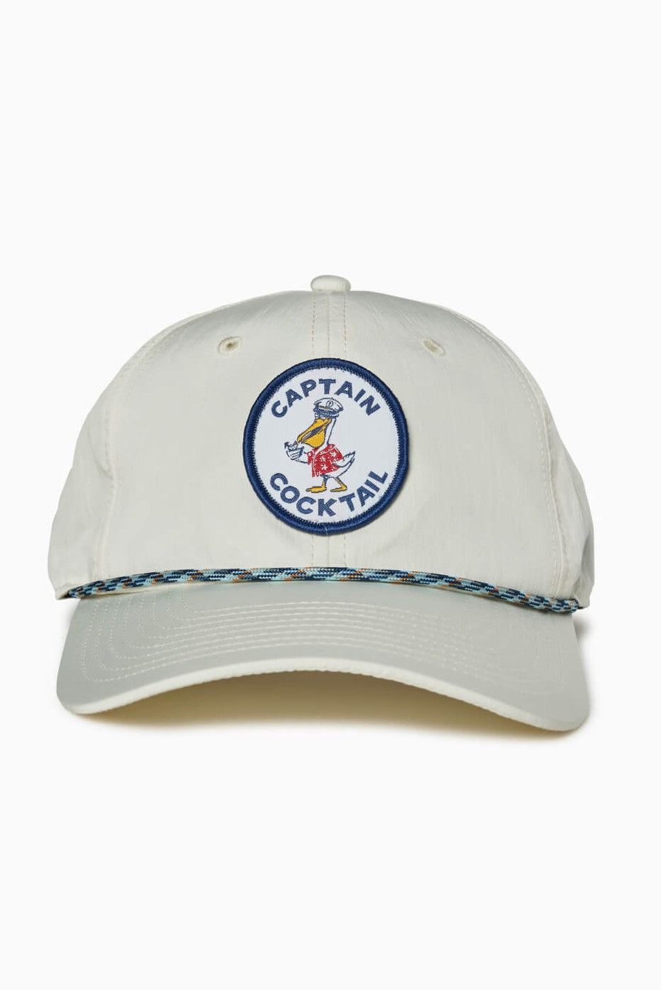 The Captain Cocktail Hat by Toes on the Nose is a light 5-panel unstructured cap with a front patch reading CAPTAIN COCKTAIL and a bird holding a drink, plus an adjustable snapback and blue/yellow braided band above the brim.